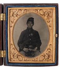 [CIVIL WAR]. 3 tintype portraits of armed soldiers housed in figural Union cases.