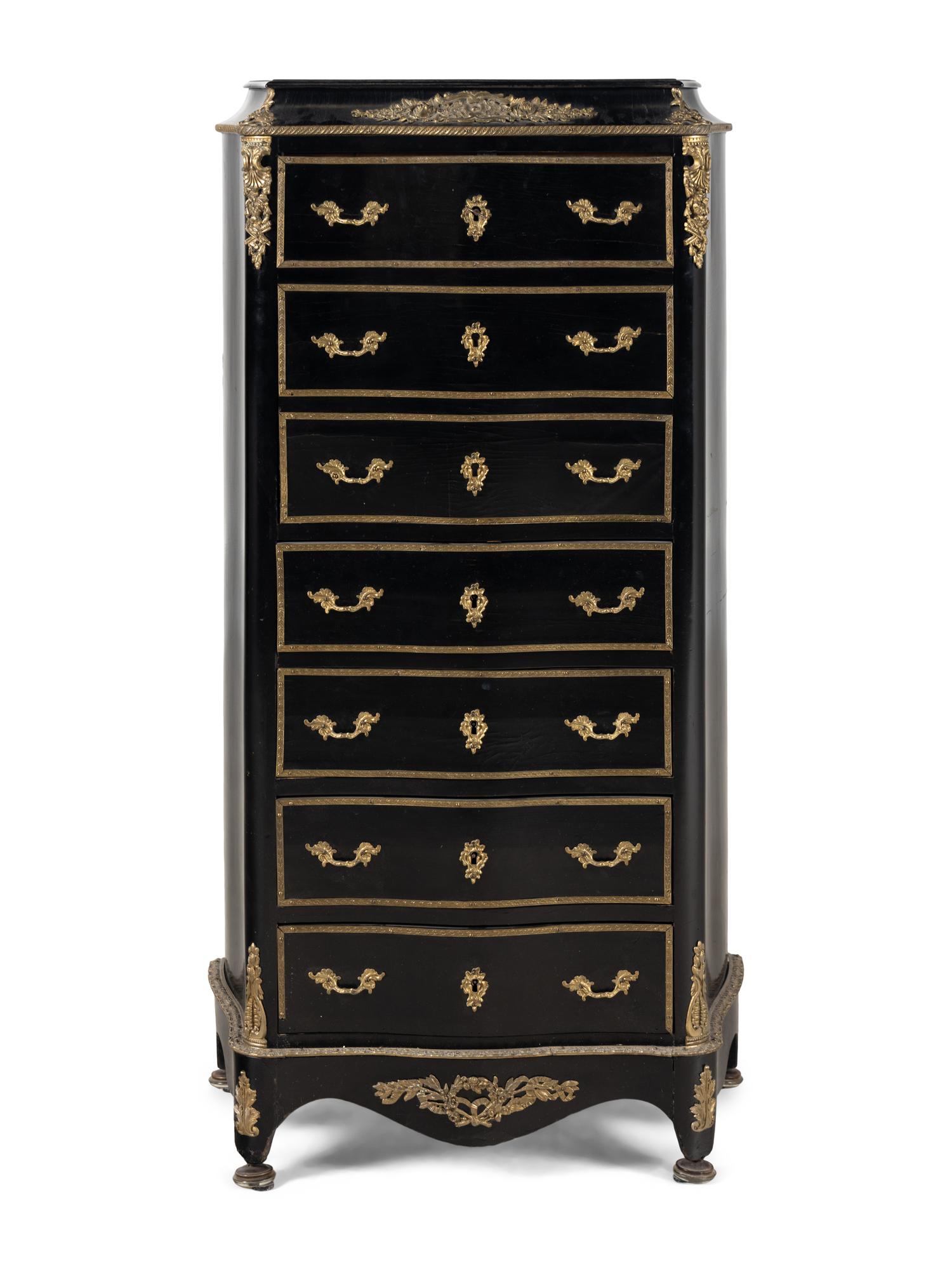 A Napoleon III Style Gilt Bronze Mounted Ebonized Semainier
