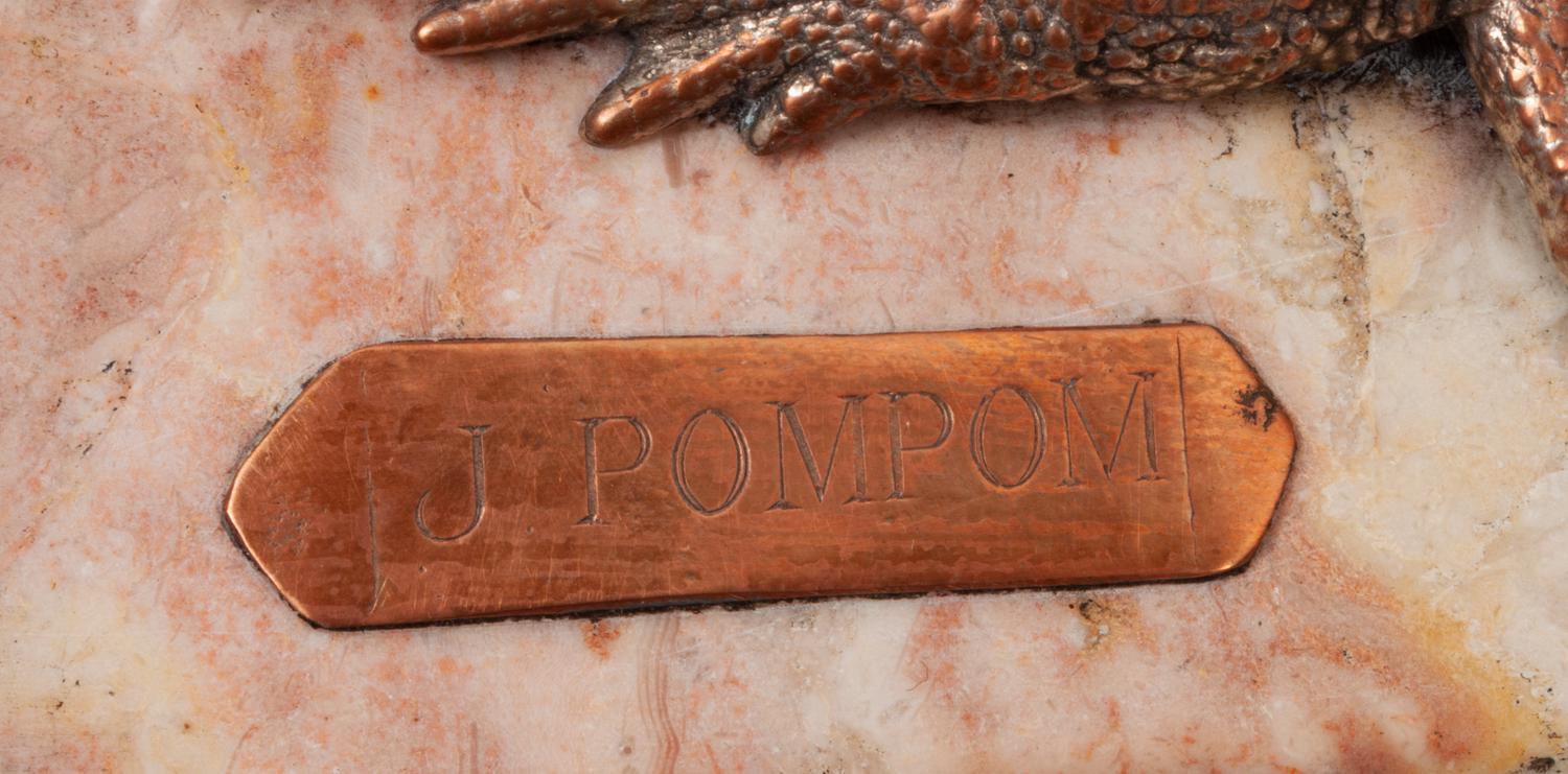 A Pair of Silvered Copper and Marble Bookends