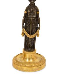 A Pair of French Gilt and Patinated Bronze Figural Candlesticks
