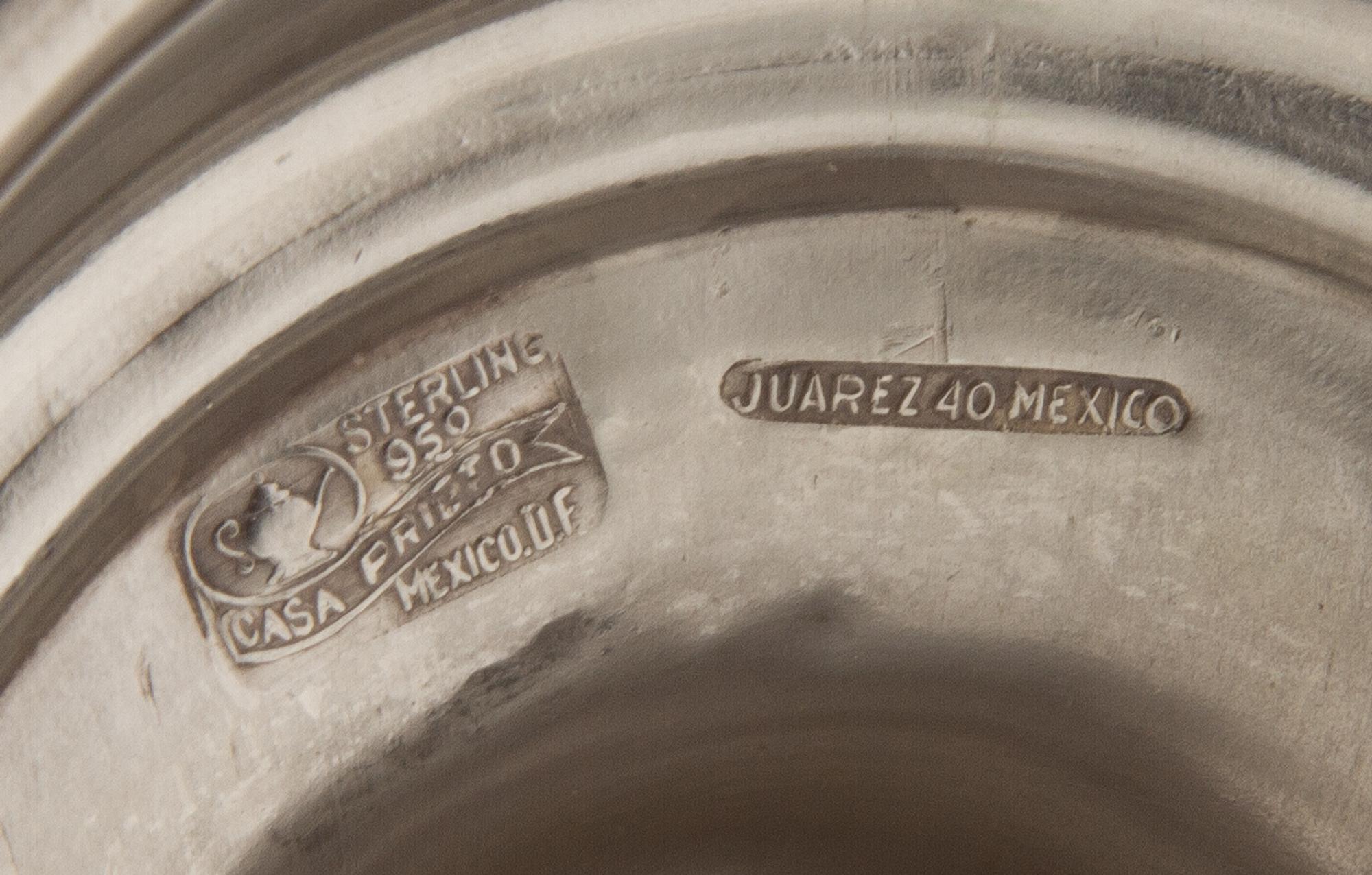 A Set of Four Mexican Silver Candlesticks, Casa Prieto, Mexico City, 1960s, each with a knopped baluster stem.