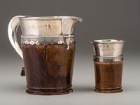 A Silver Mounted Mahogany Pitcher and Six Cups