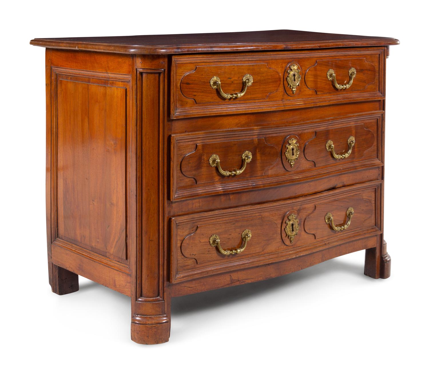 A Régence Gilt Metal Mounted Carved Walnut Serpentine Commode