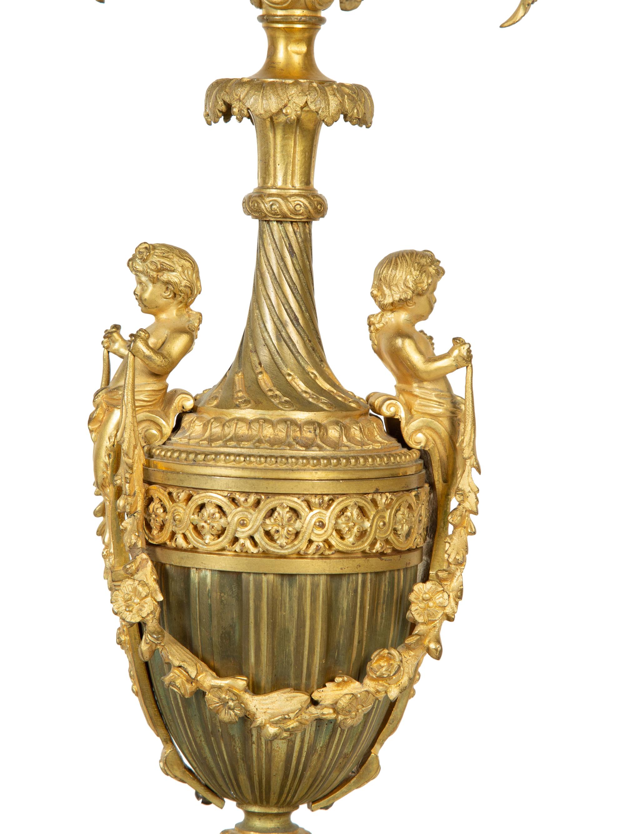 A Pair of French Gilt Bronze and Marble Urn-Form Six-Light Candelabra
