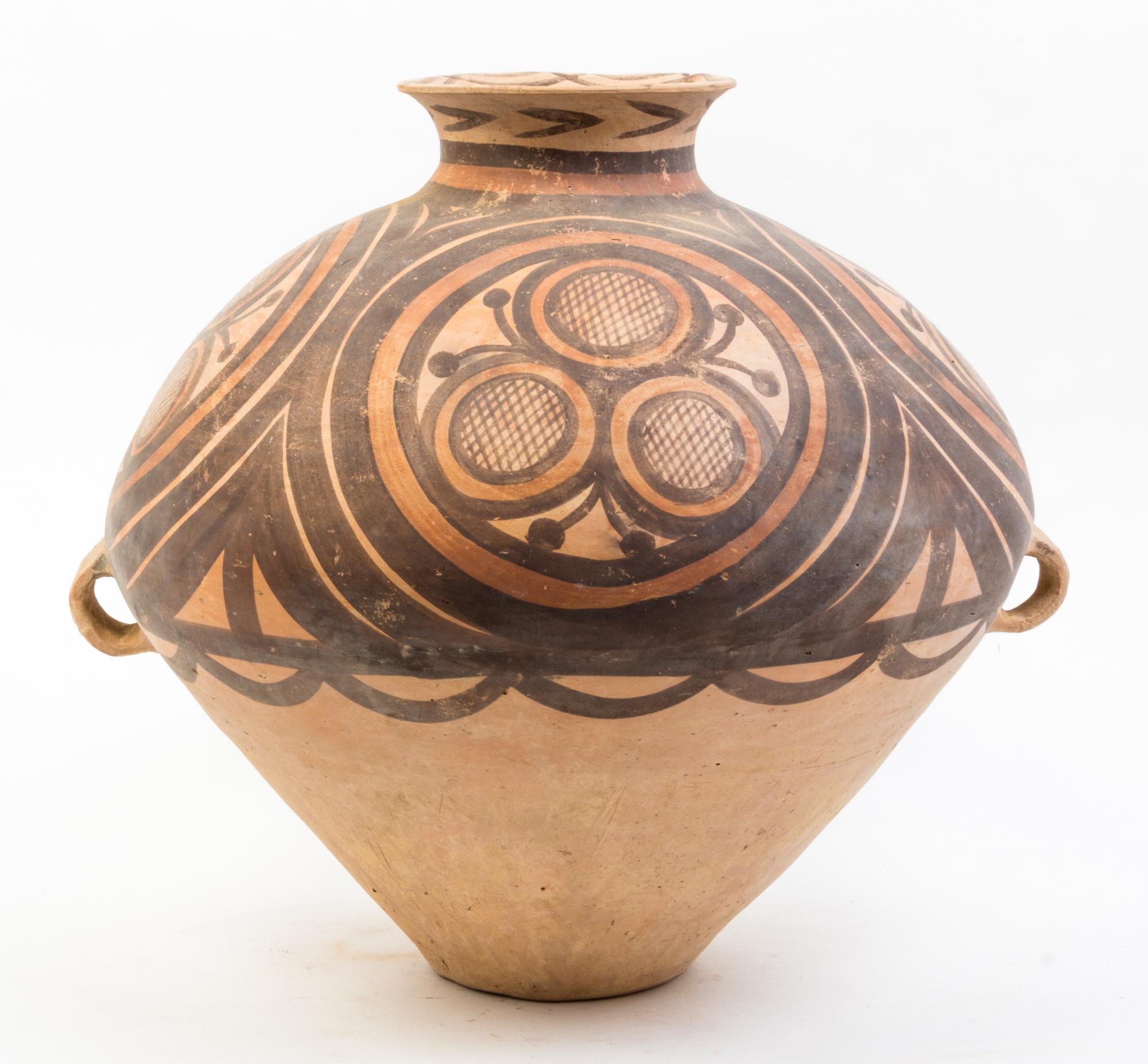 A Large Neolithic Style Pottery Jar Height 16 inches.