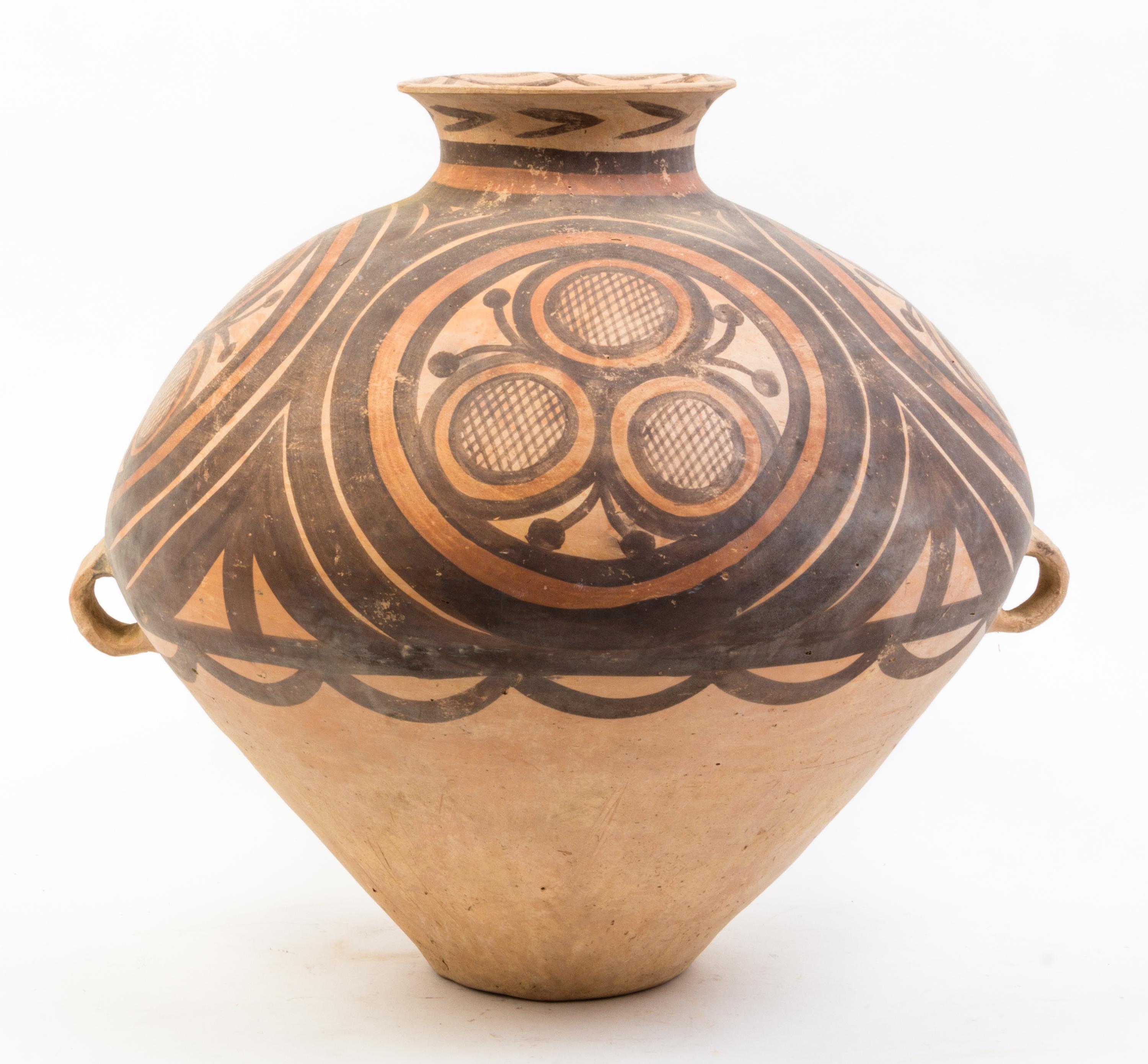 A Large Neolithic Style Pottery Jar Height 16 inches.