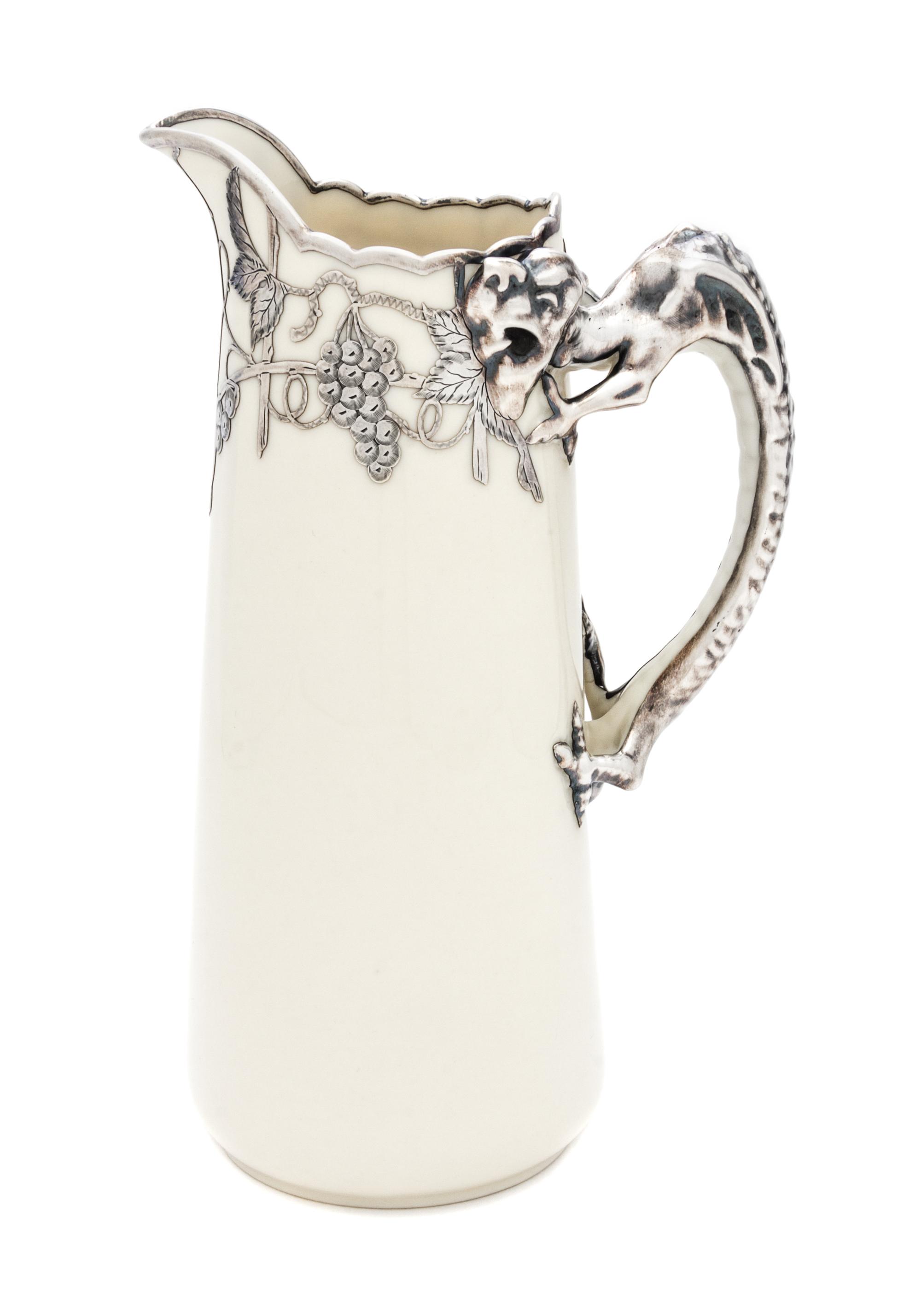A Belleek Willets Silver Overlay Ewer Height 9 1/2 inches.