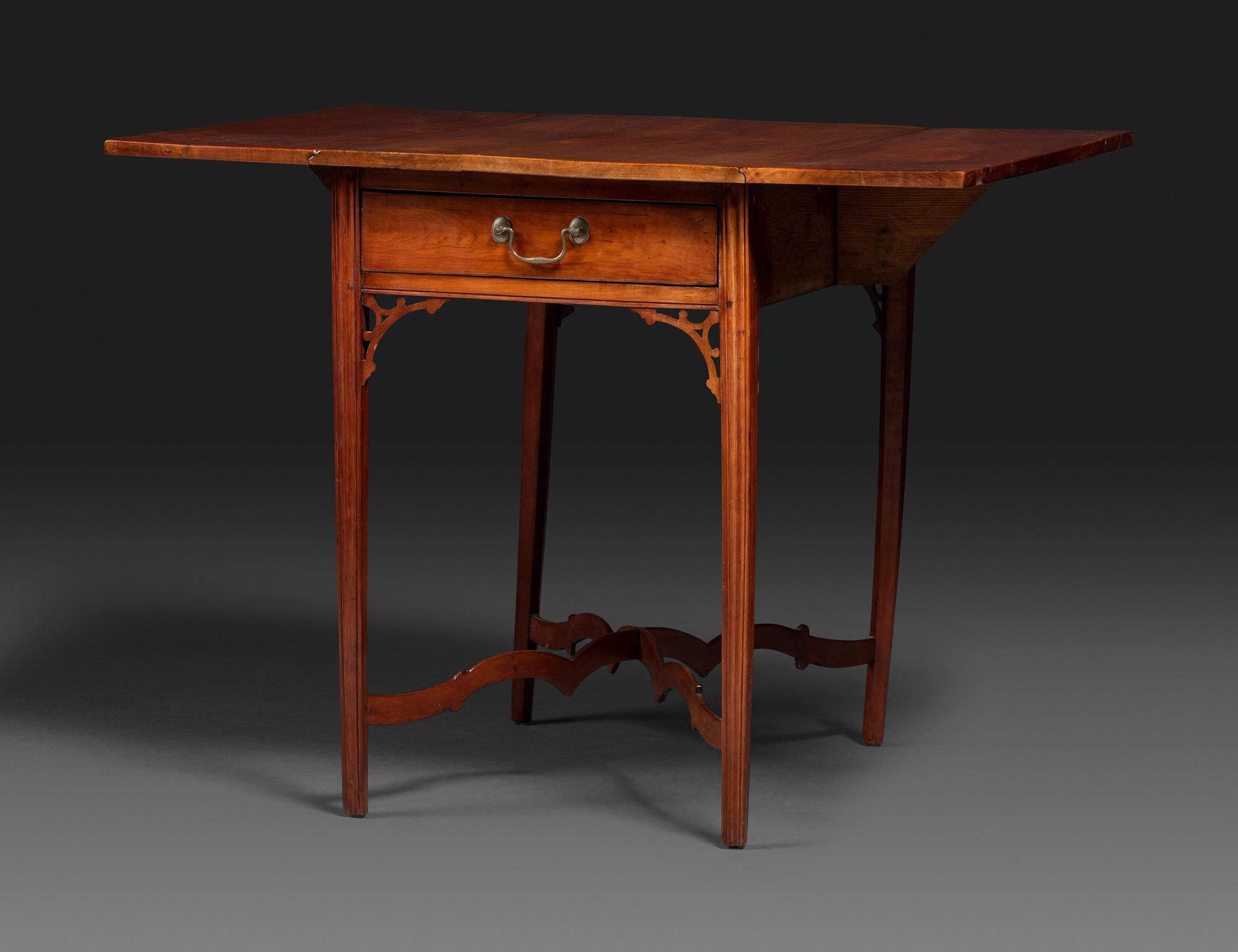 A Late Chippendale Carved Cherrywood Stretcher-Base Pembroke Table