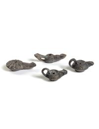 Four Roman Molded Terra Cotta Oil Lamps