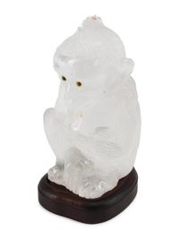 A Carved Rock Crystal Model of a Seated Monkey