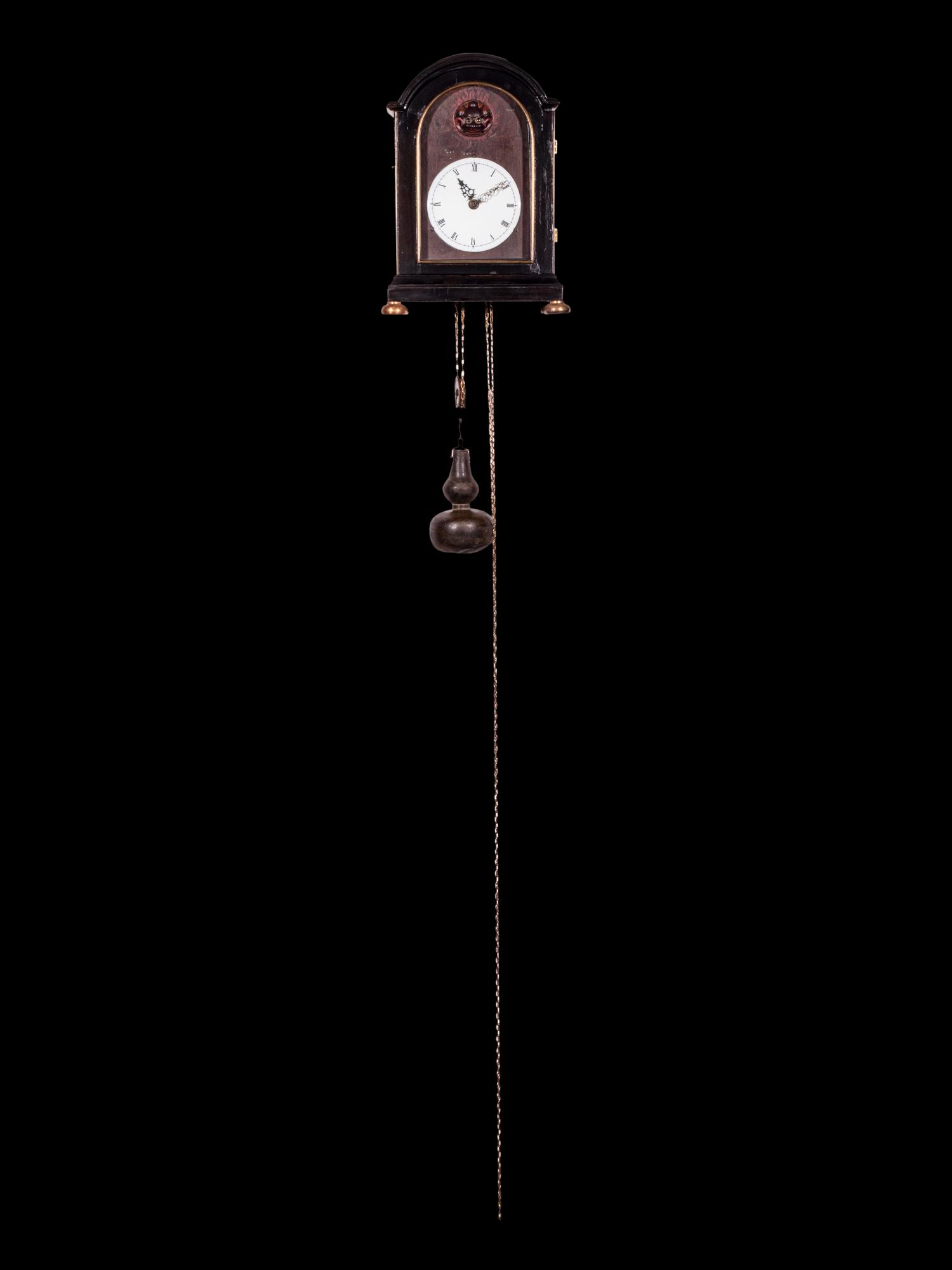 A Japanese Ebonized Cased Lantern Clock with Gourd-Form Weight
