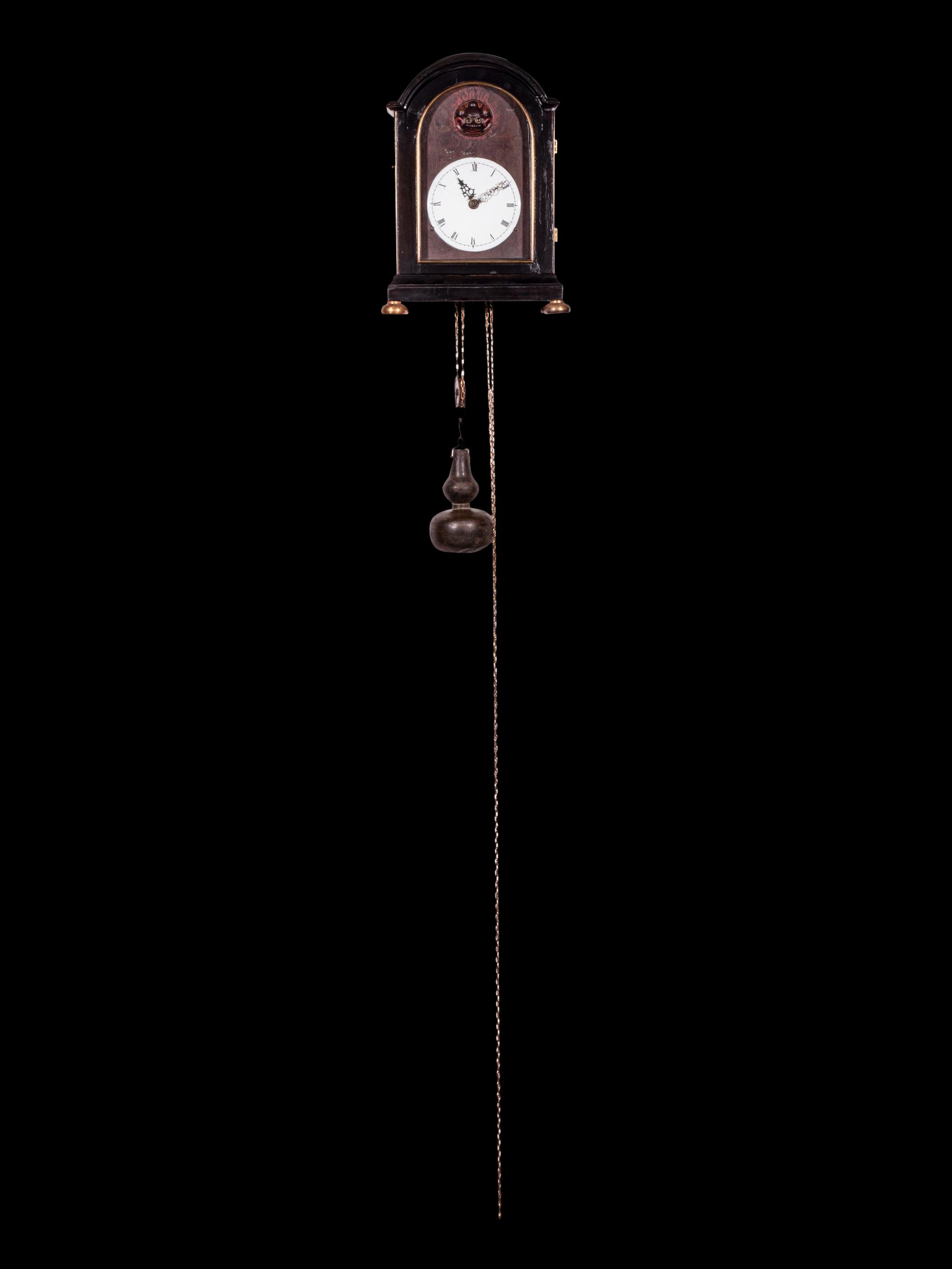 A Japanese Ebonized Cased Lantern Clock with Gourd-Form Weight