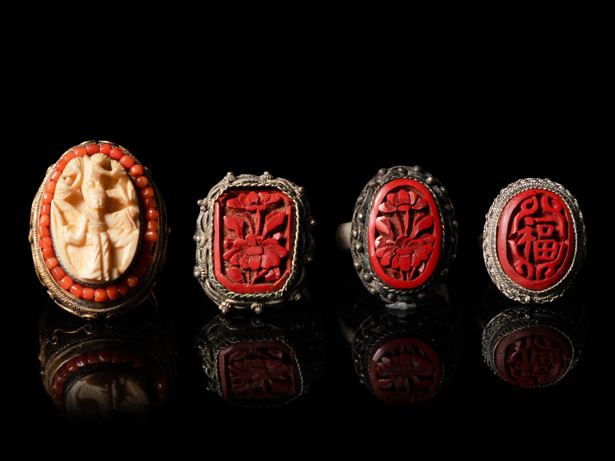 Four Chinese Red Lacquer Inset Silver Rings
