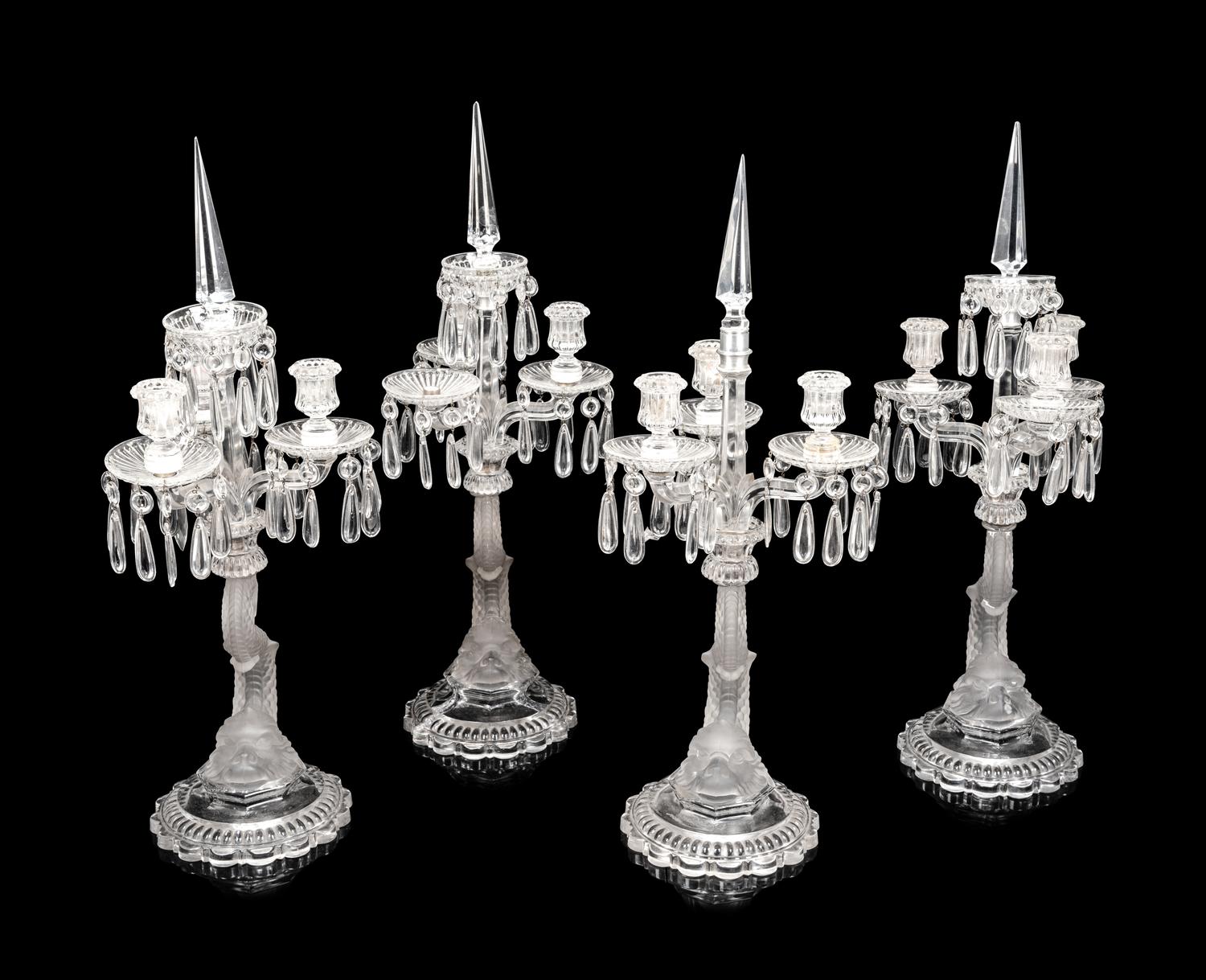 A Set of Four Baccarat Dauphin Three-Light Candelabra