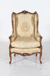 A Louis XV Style Carved Walnut Bergere