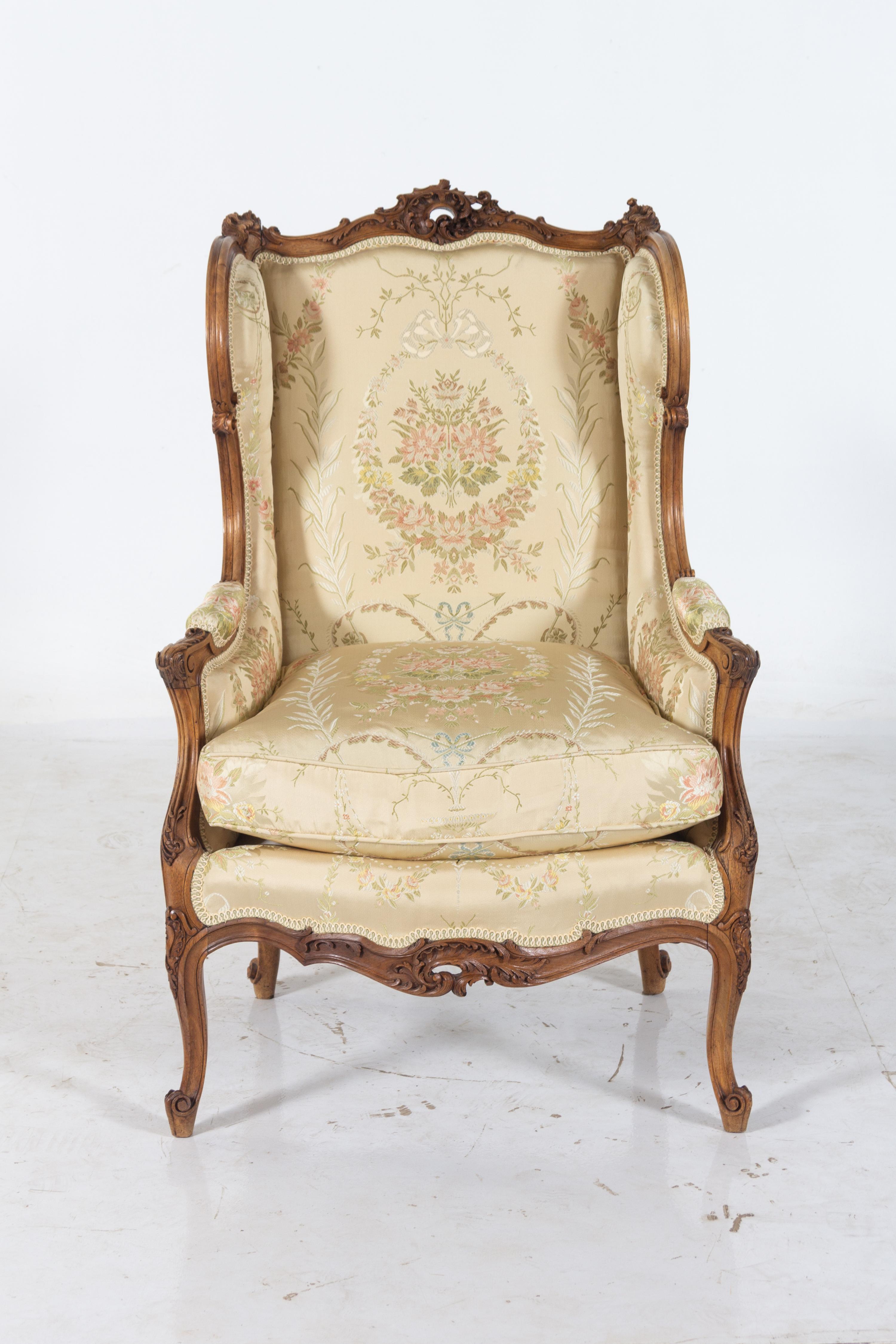A Louis XV Style Carved Walnut Bergere