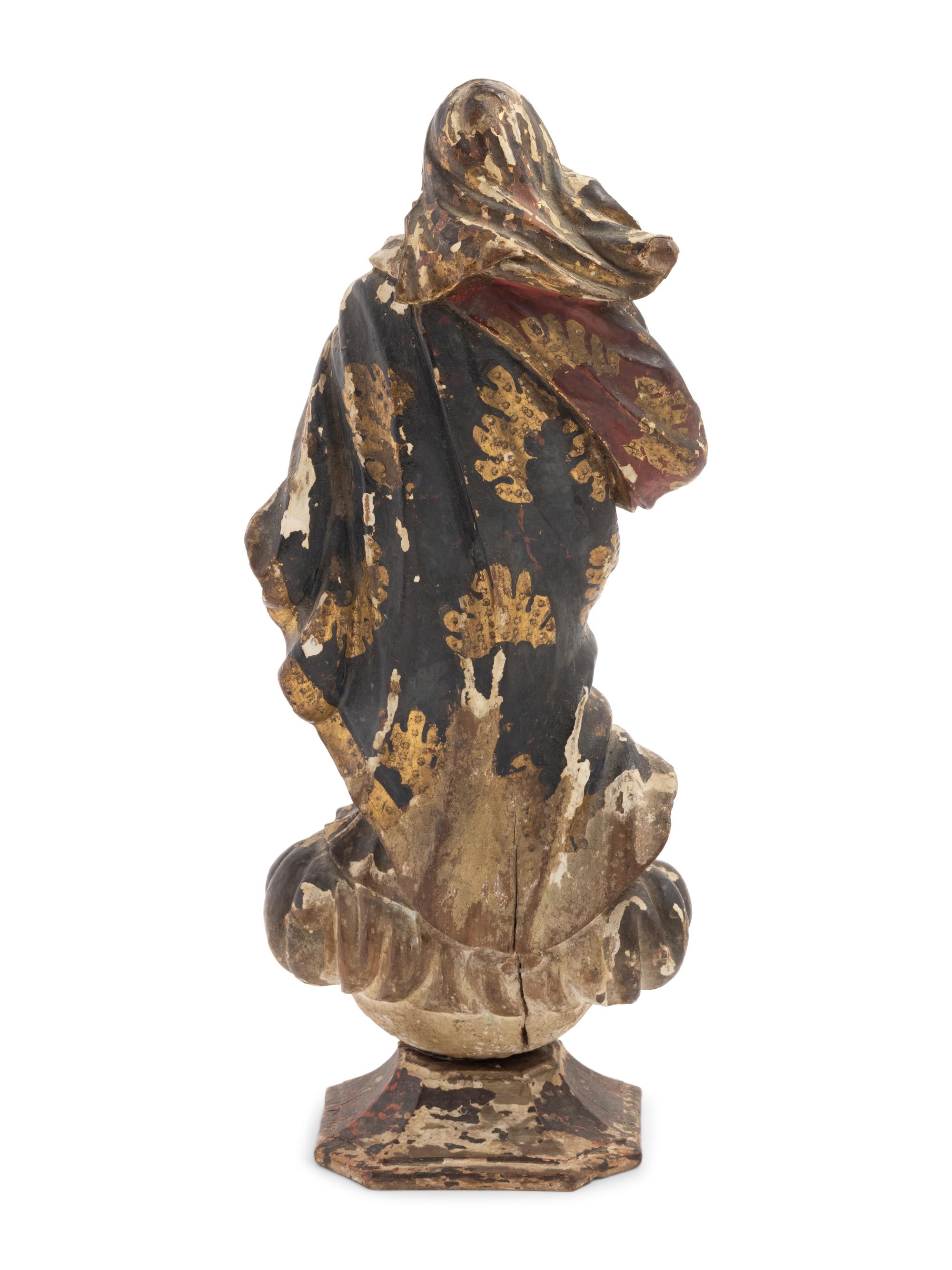 A Continental Painted and Parcel Gilt Carved Wood Figure of an Angel