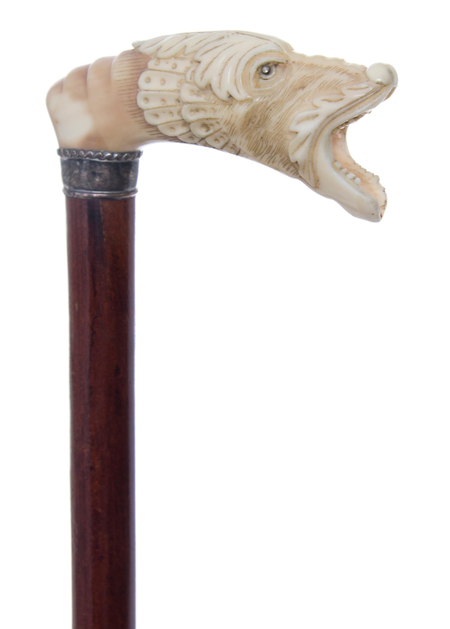 An English Ivory Handled Cane, Length of handle 3 7/8 x length overall 33 3/4 inches.