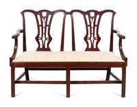 A George III Style Carved Mahogany Double-Back Settee