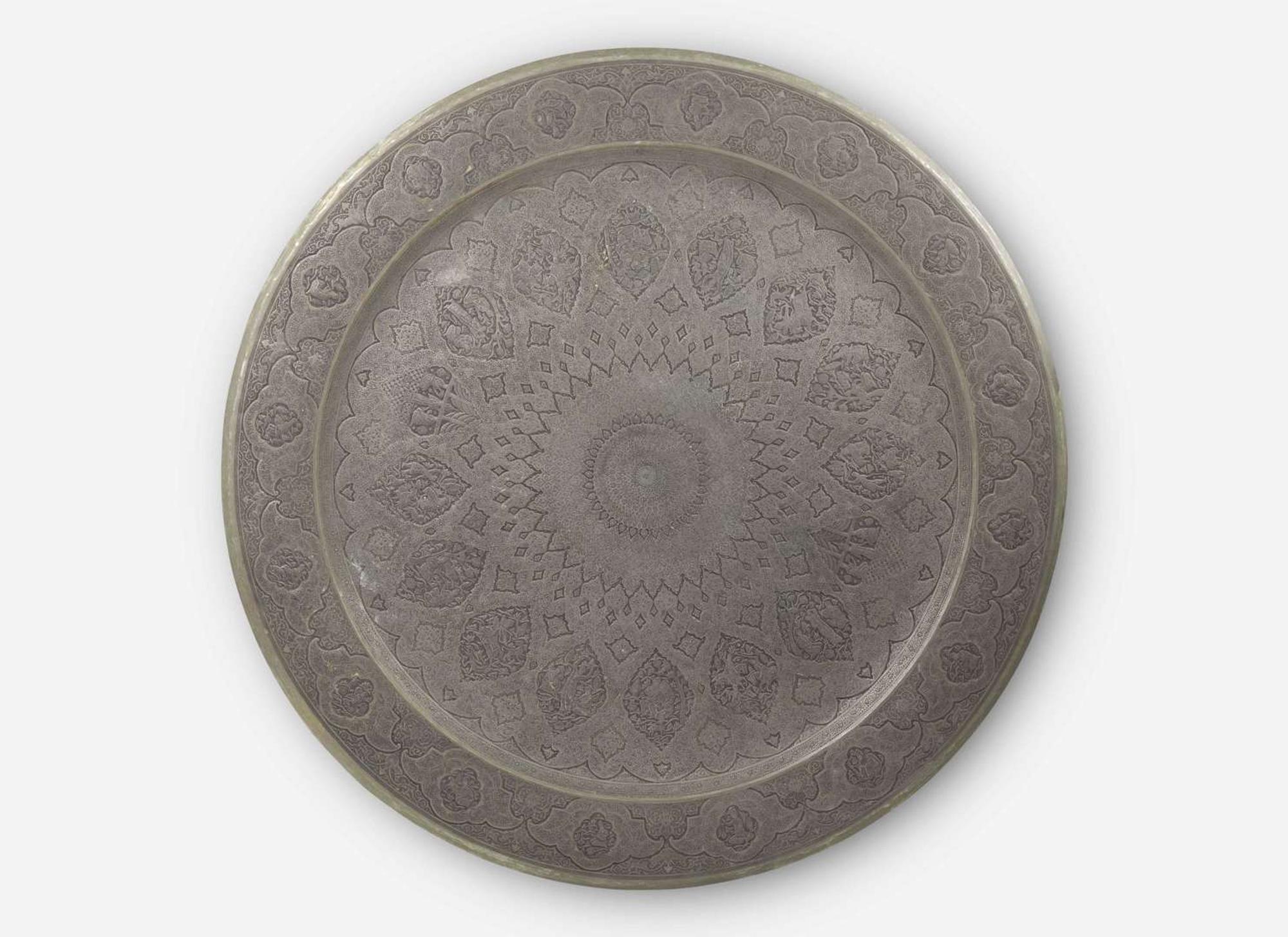 A large Persian hand-dotted silvered metal tray, probably Isfahan, circa 1900