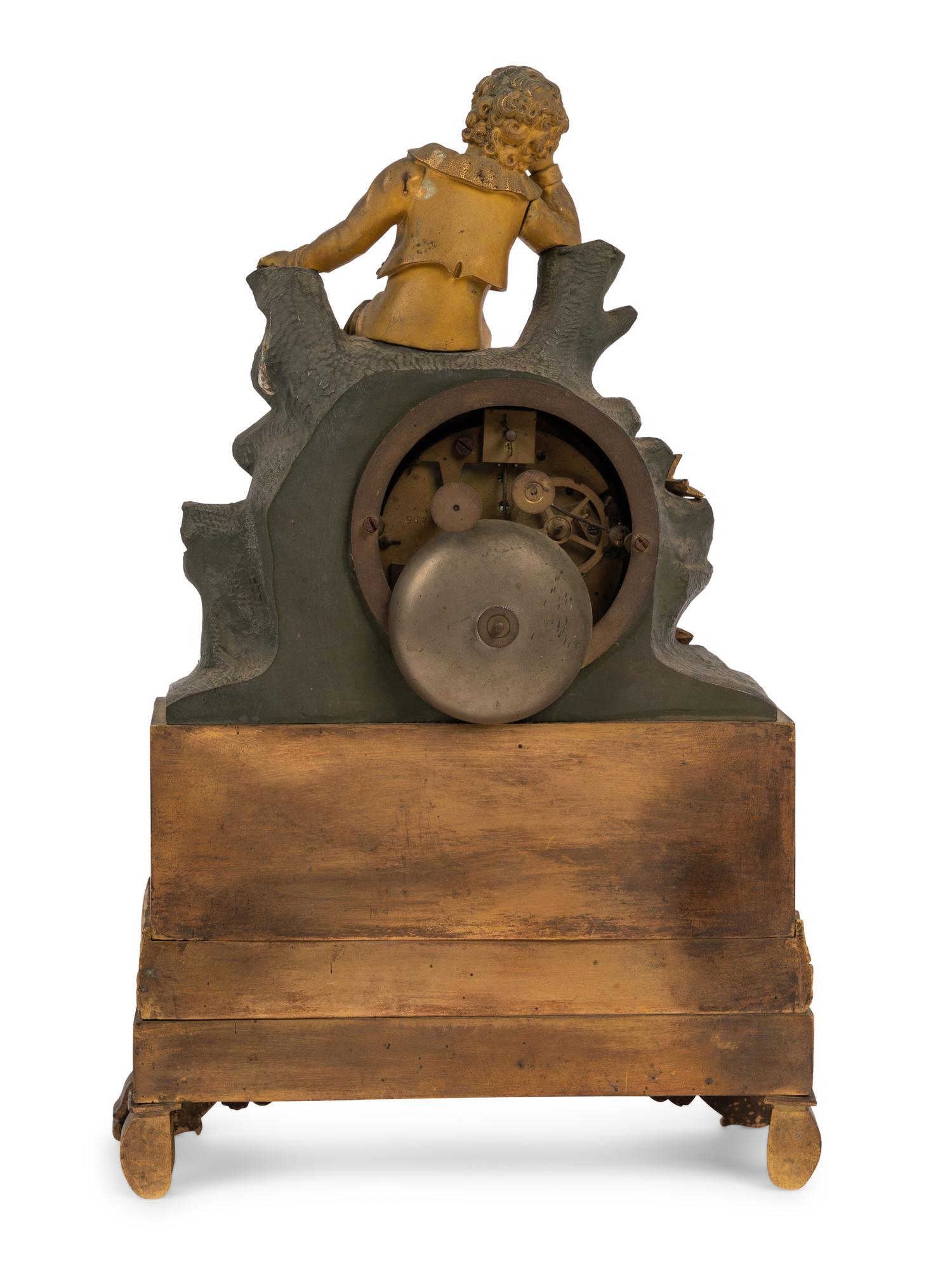 A Charles X Gilt and Patinated Bronze Figural Mantel Clock