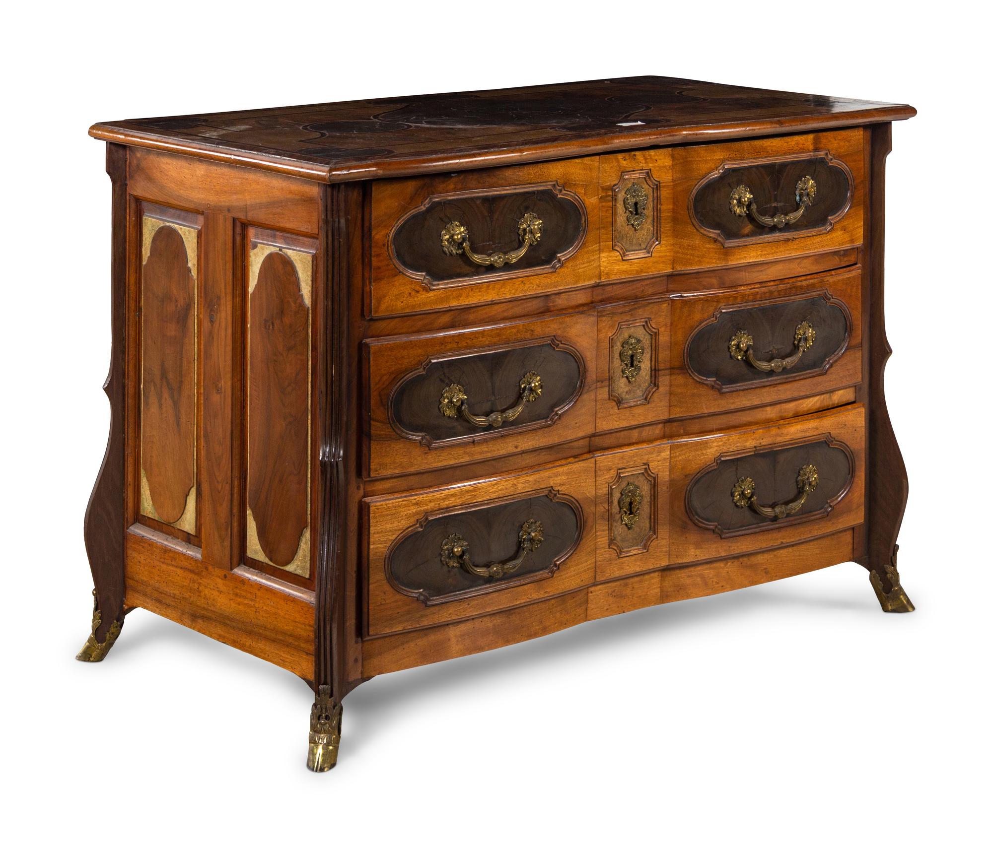 A Louis XIV Gilt Bronze Mounted Walnut and Oysterwood Commode