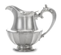 An American Silver Small Pitcher, Frank W. Smith Silver Co., Gardner, MA, of baluster form with a paneled lower body.
