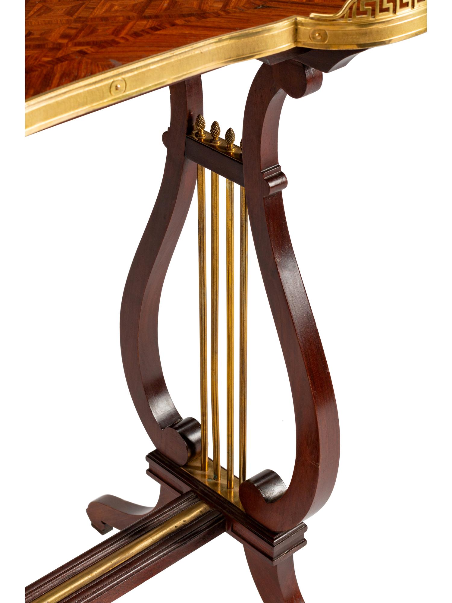 A Louis XVI Style Gilt-Bronze-Mounted Mahogany Kidney-Shaped Table