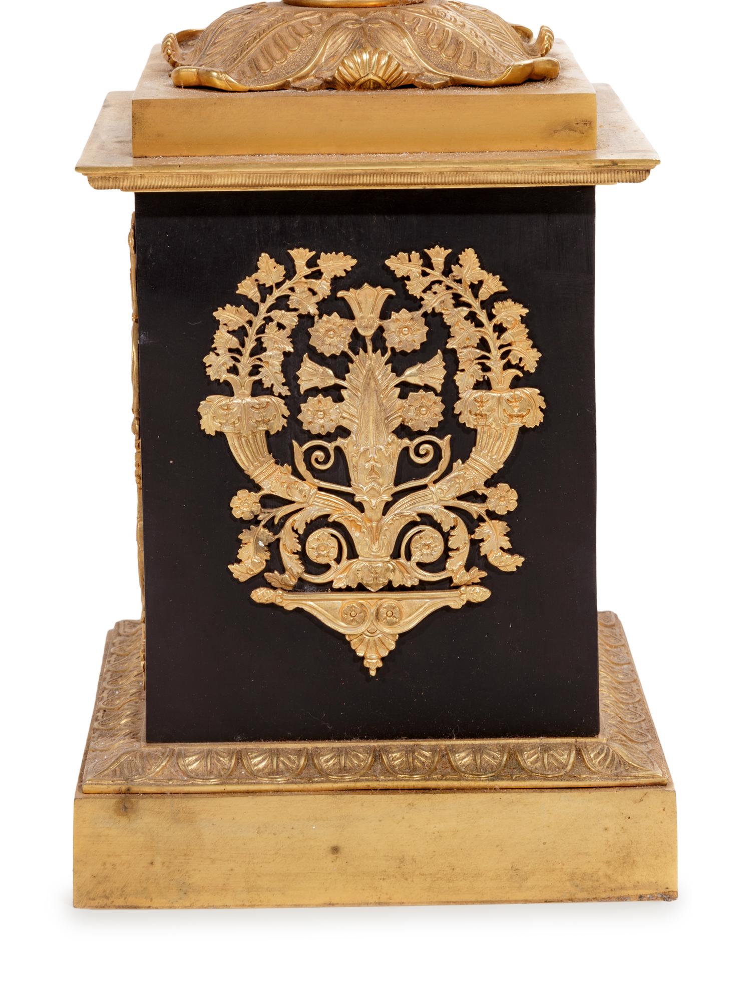 A Pair of Empire Style Gilt and Patinated Cast Metal Seven-Light Torchères