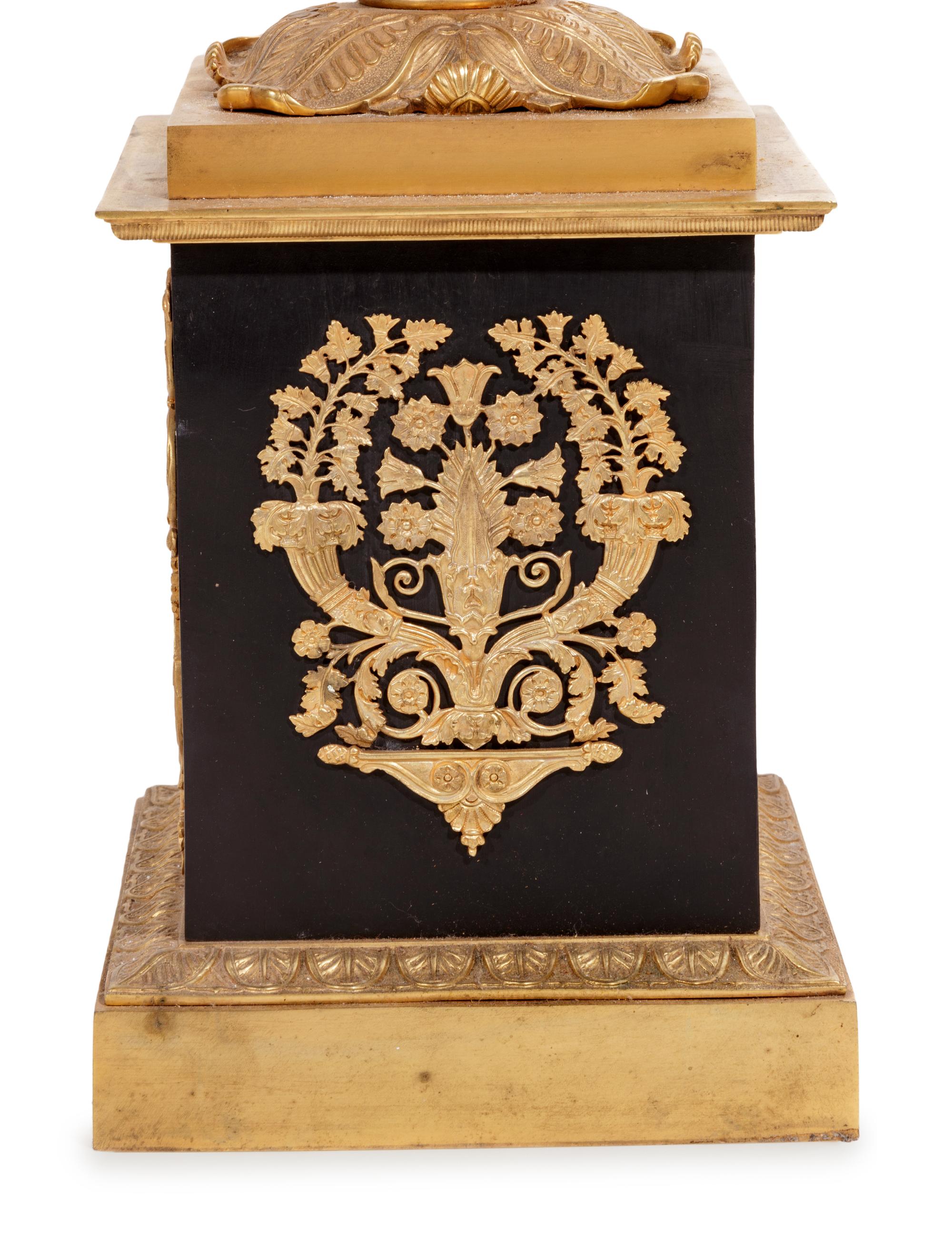 A Pair of Empire Style Gilt and Patinated Cast Metal Seven-Light Torchères
