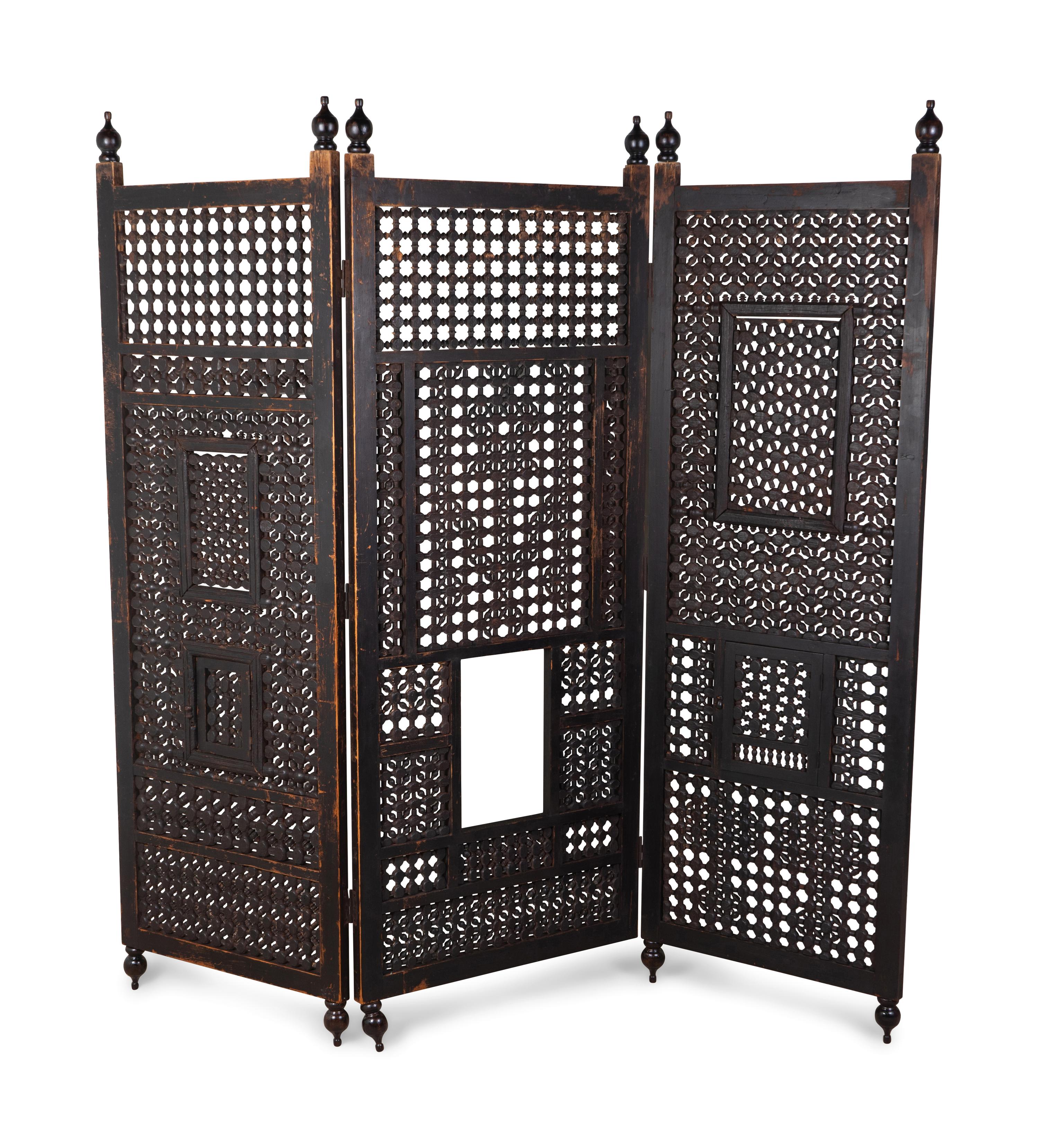 An Indian Pierced Carved Teak Three-Panel Floor Screen — 20TH CENTURY
