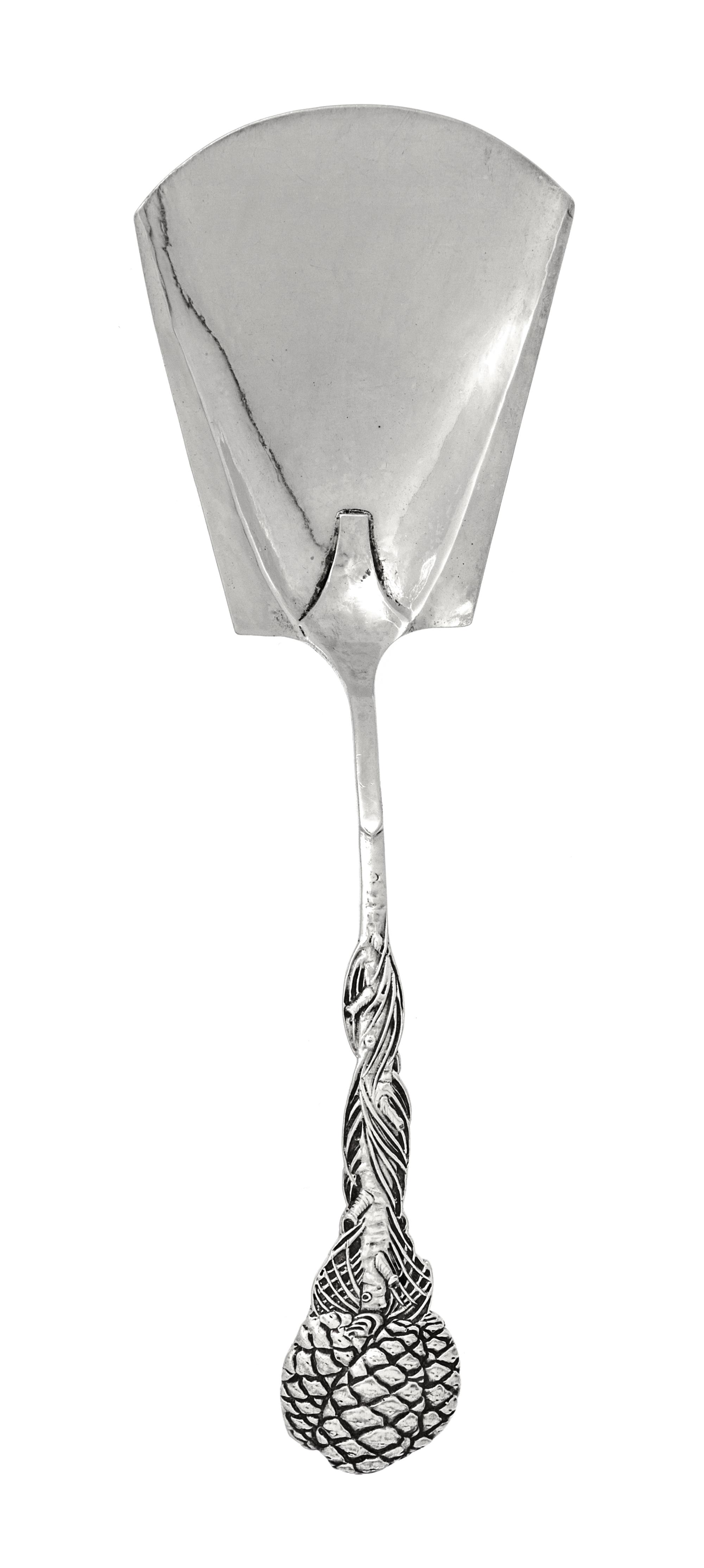 A George V Silver Scoop, Omar Ramsden, London, 1923, having a trapezoidal bowl and a pine cone decorated handle.