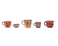 A Group of Five Glazed Redware Mugs and Porringers, Pennsylvania, 19th Century
