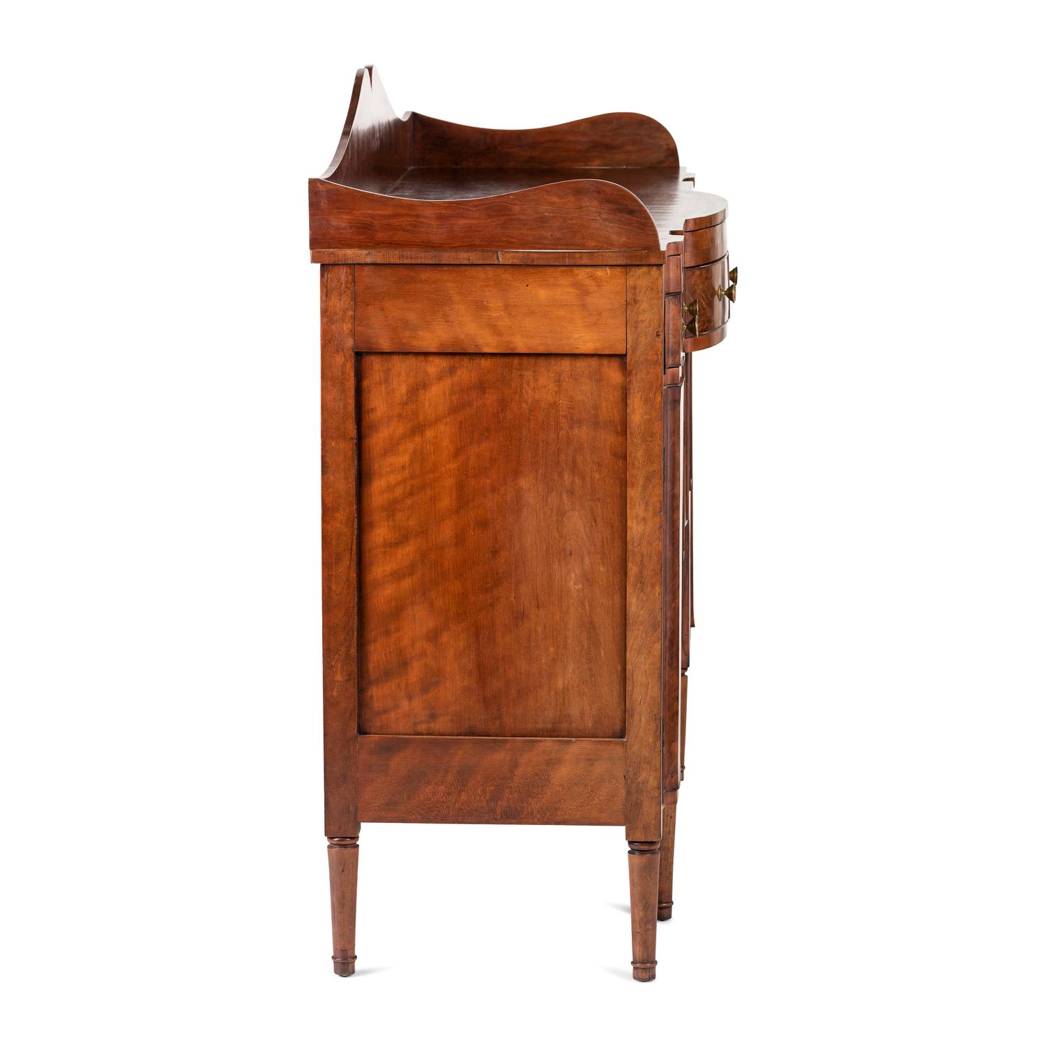 A Classical Highly Figured Cherrywood Scallop-Front Sideboard