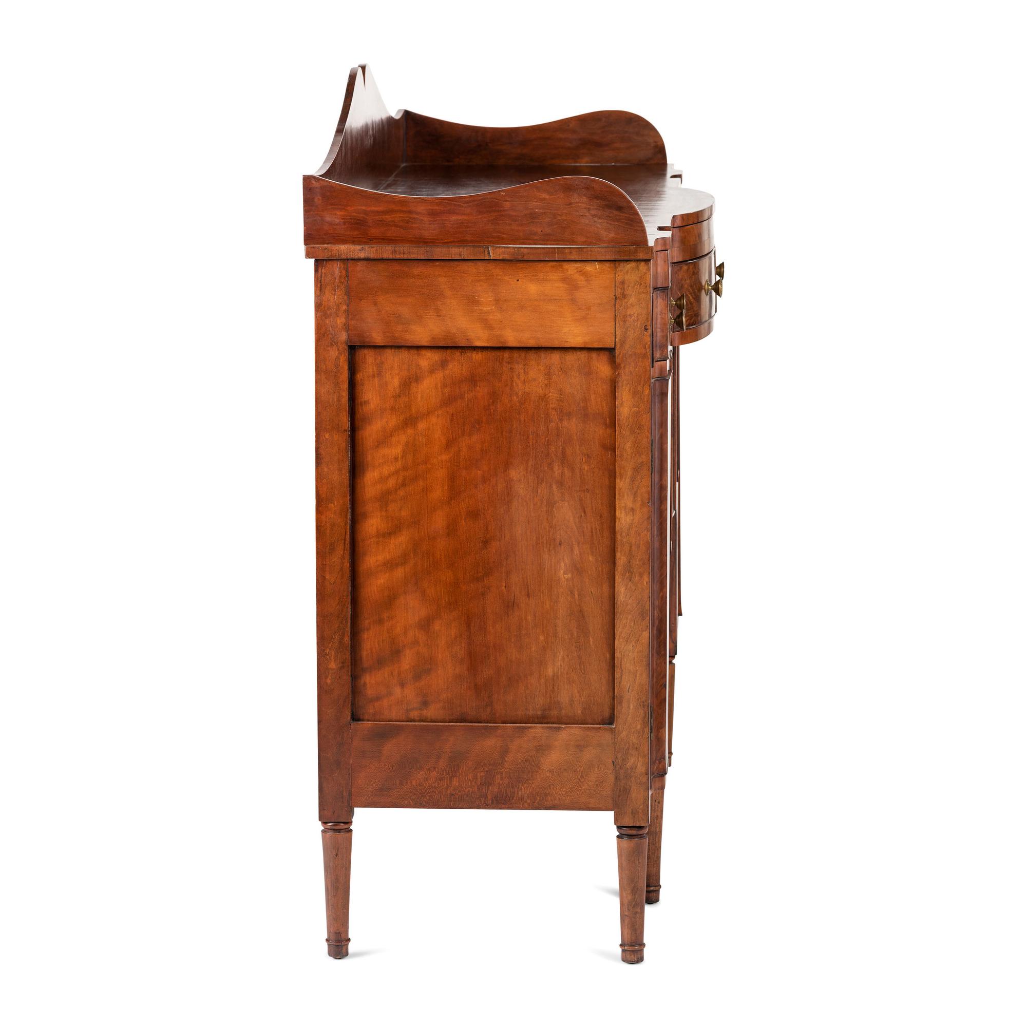 A Classical Highly Figured Cherrywood Scallop-Front Sideboard
