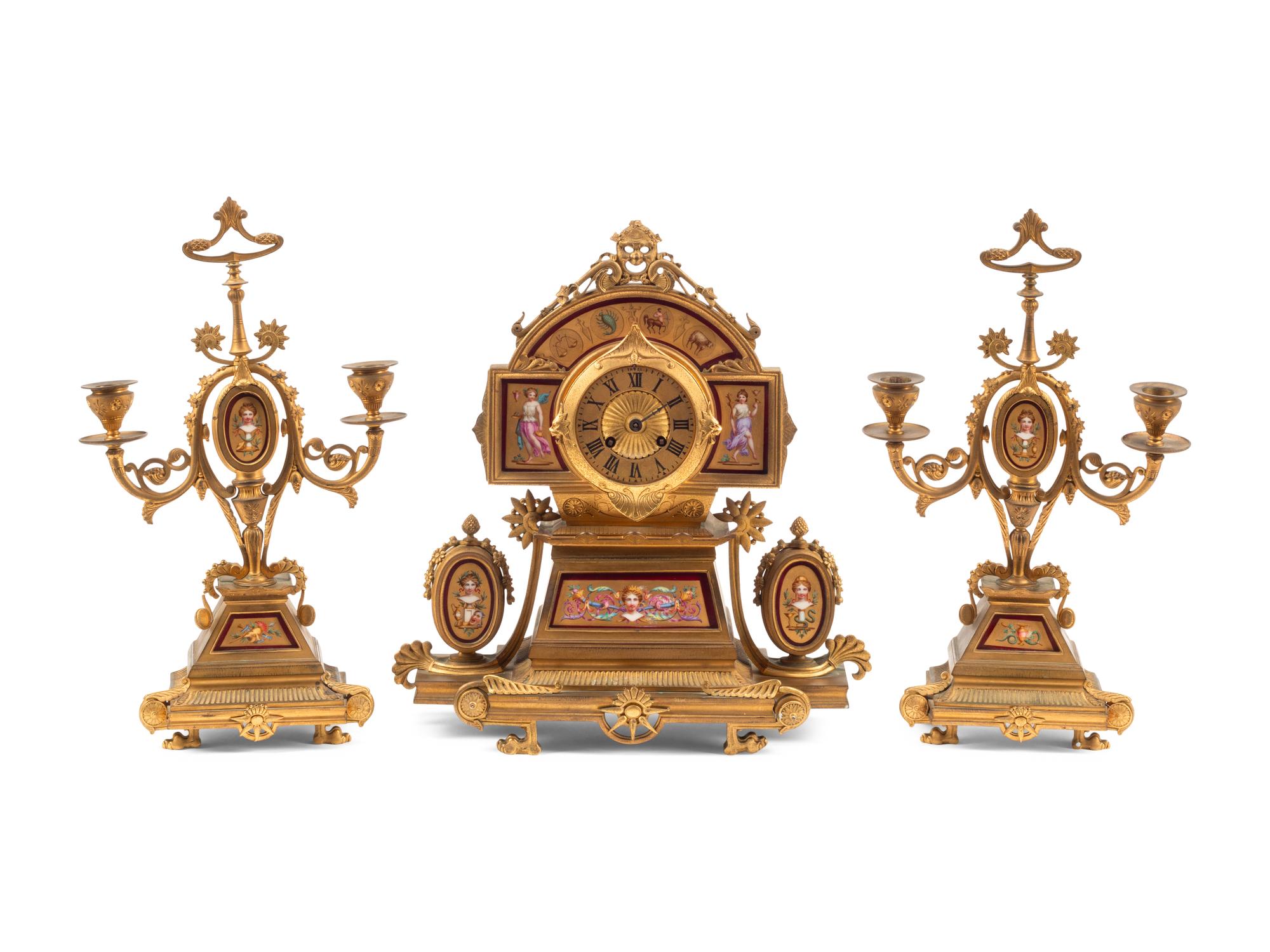 A French Neoclassical Gilt Bronze and Porcelain Plaque-Inset Clock Garniture