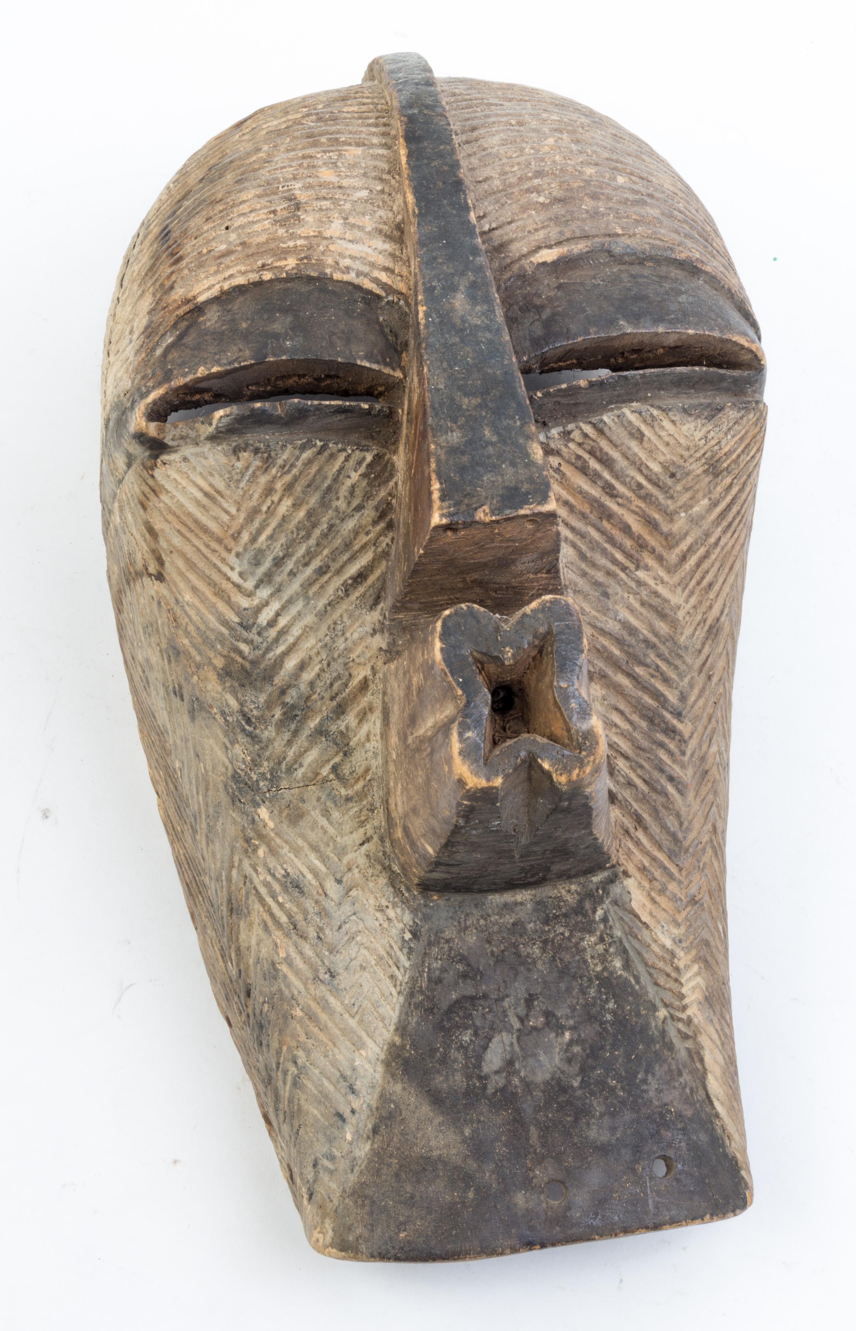 Two Ugandan Wood Busts or Masks Height of larger 25 inches.