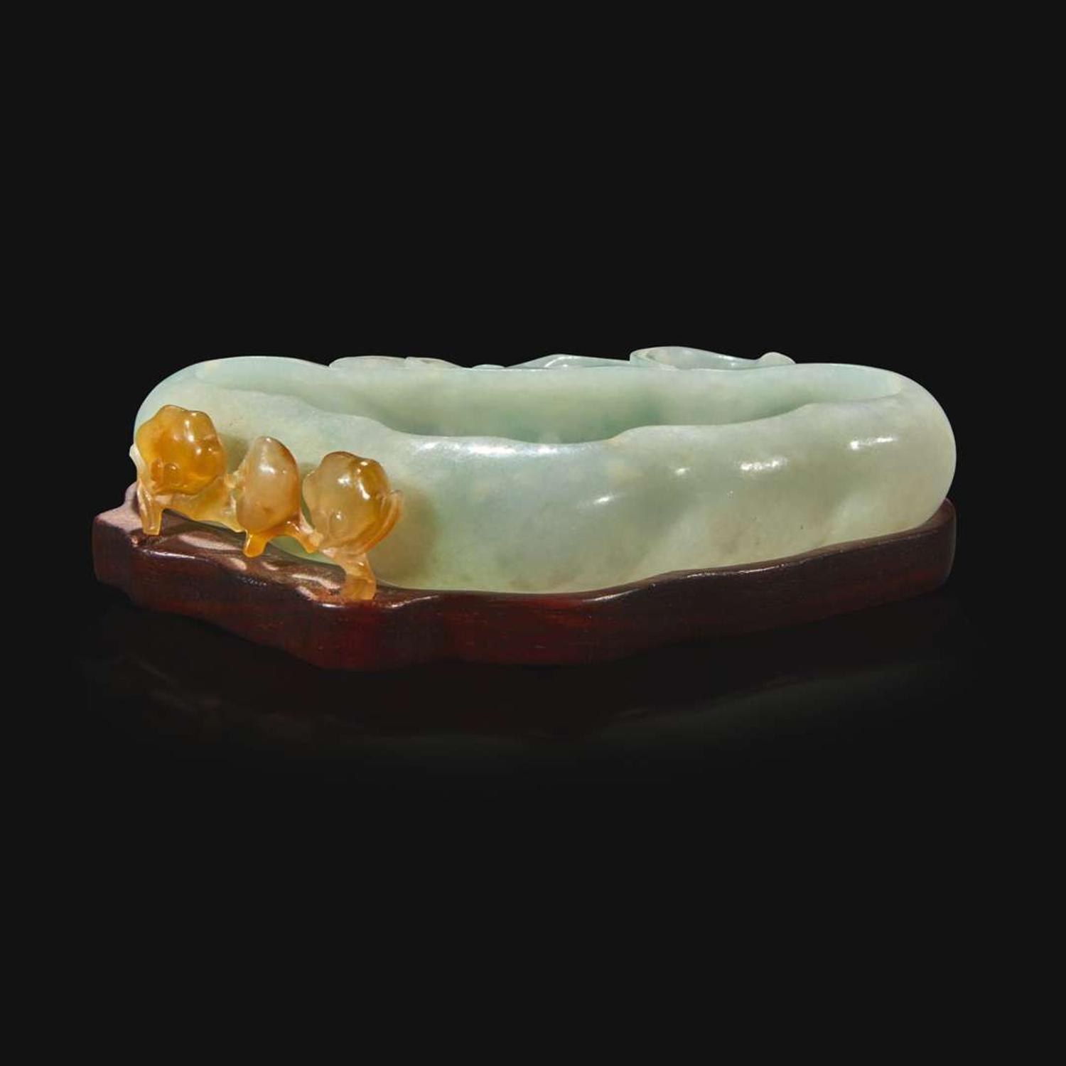 A Chinese carved pale greenish-white and russet jadeite brush washer