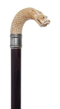 A Chinese Ivory Handled Cane, Length of handle 4 1/2 x length overall 35 inches.
