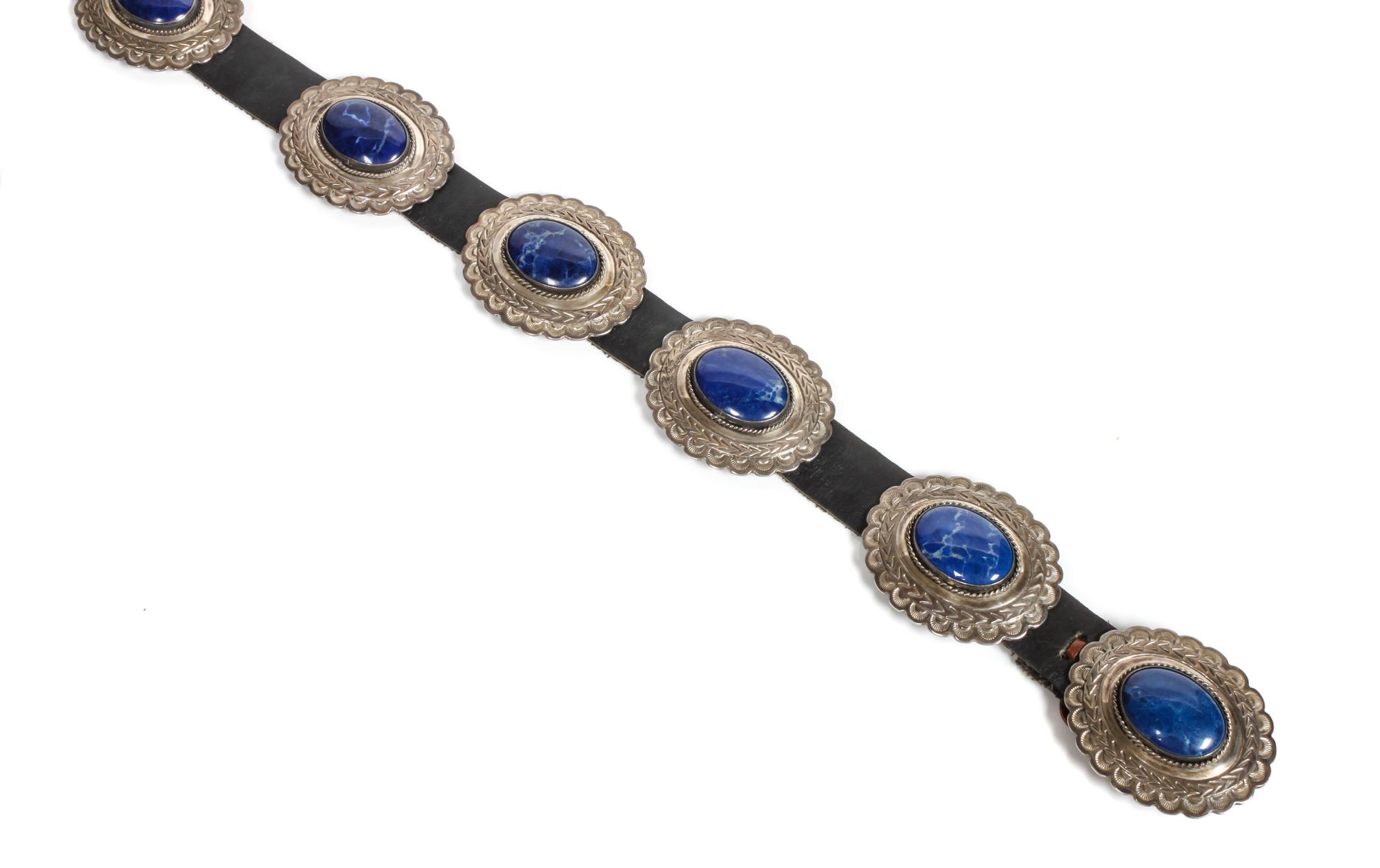A Southwestern Silver and Blue Hard Stone Concho Belt Length overall 50 inches