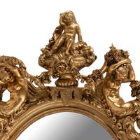 A Louis XV Style Carved Giltwood Oval Mirror