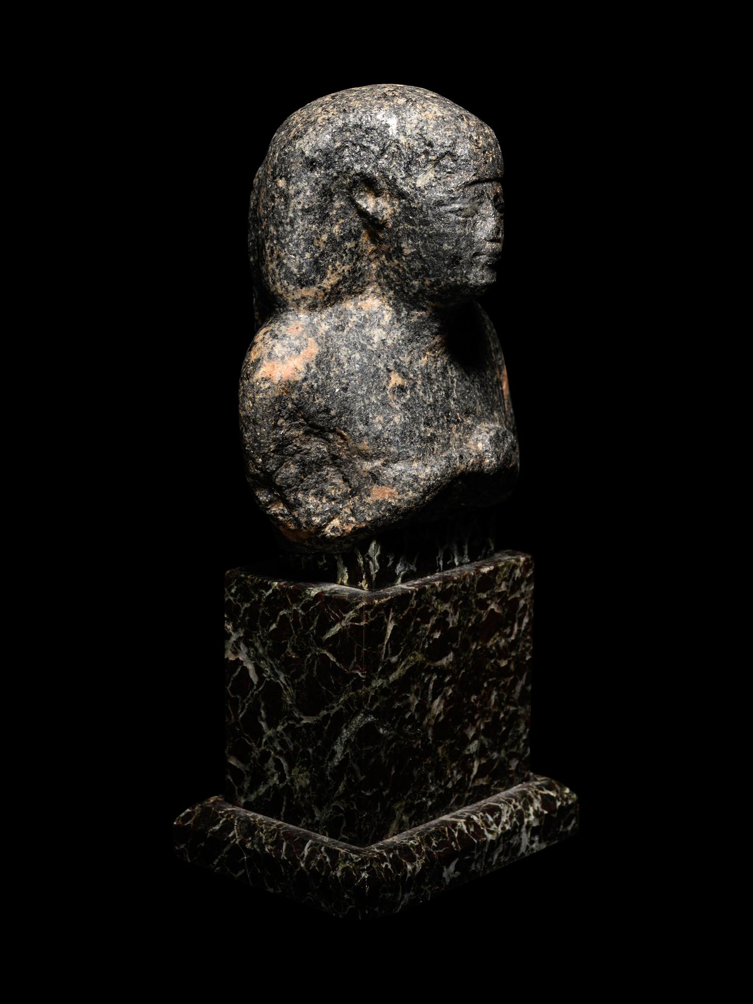 An Egyptian Granite Bust of a Man