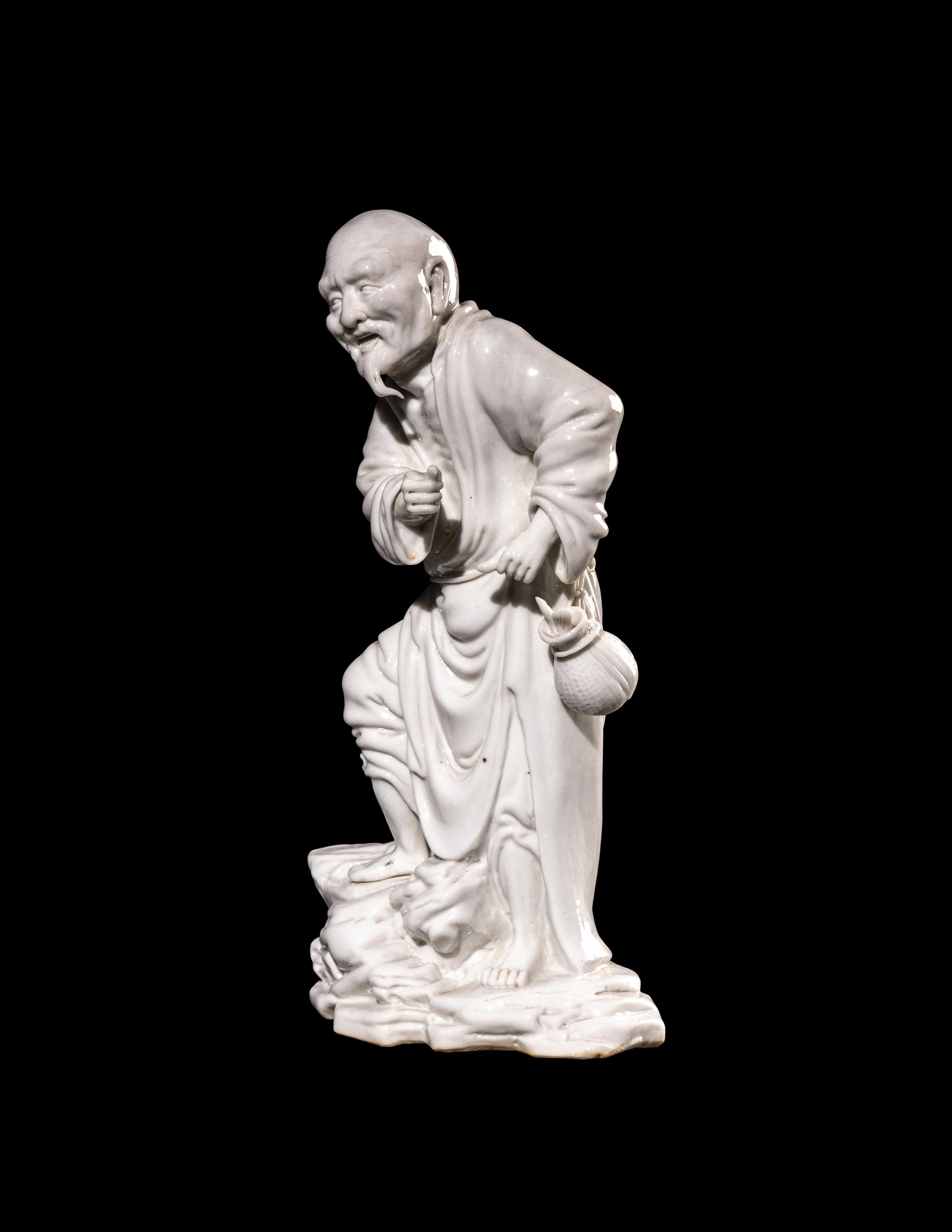 A Chinese Blanc-de-Chine Porcelain Figure of a Fisherman