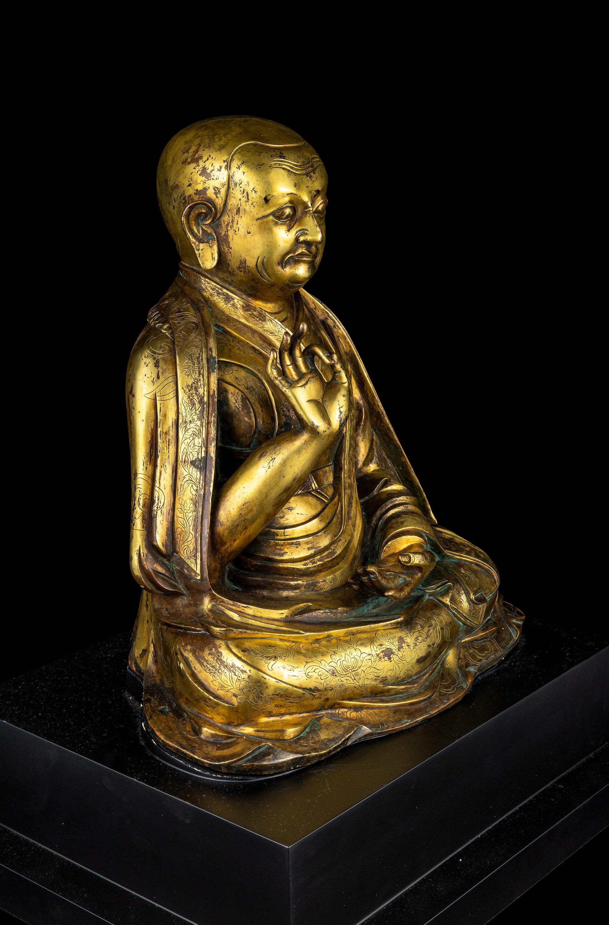 A Large Sino-Tibetan Gilt Bronze Figure of a Lama 巨型銅鎏金上師坐像