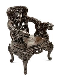 A Chinese Export Carved Hardwood Armchair