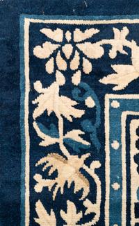 A Chinese Wool Rug with a Buddhistic Lion