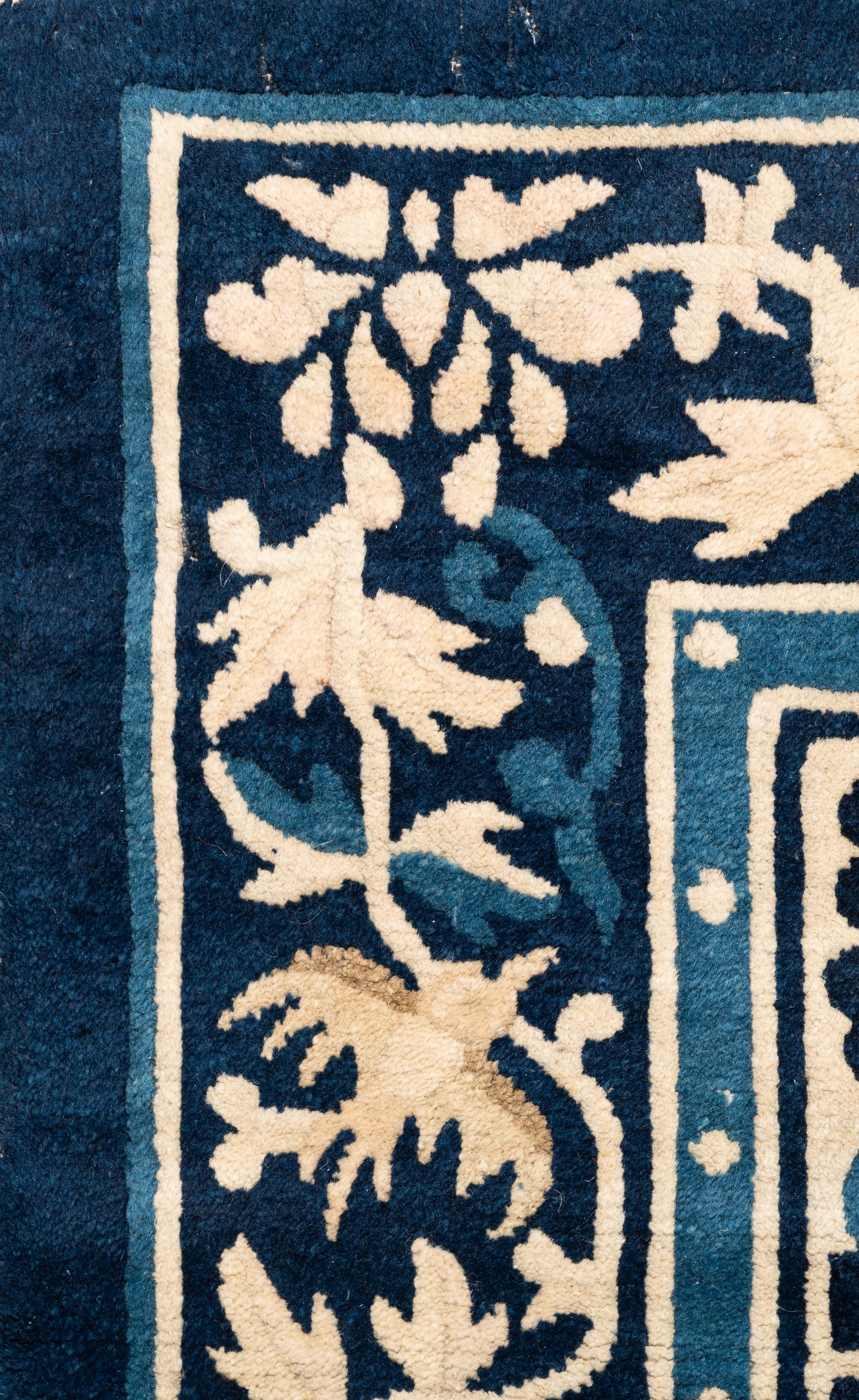 A Chinese Wool Rug with a Buddhistic Lion