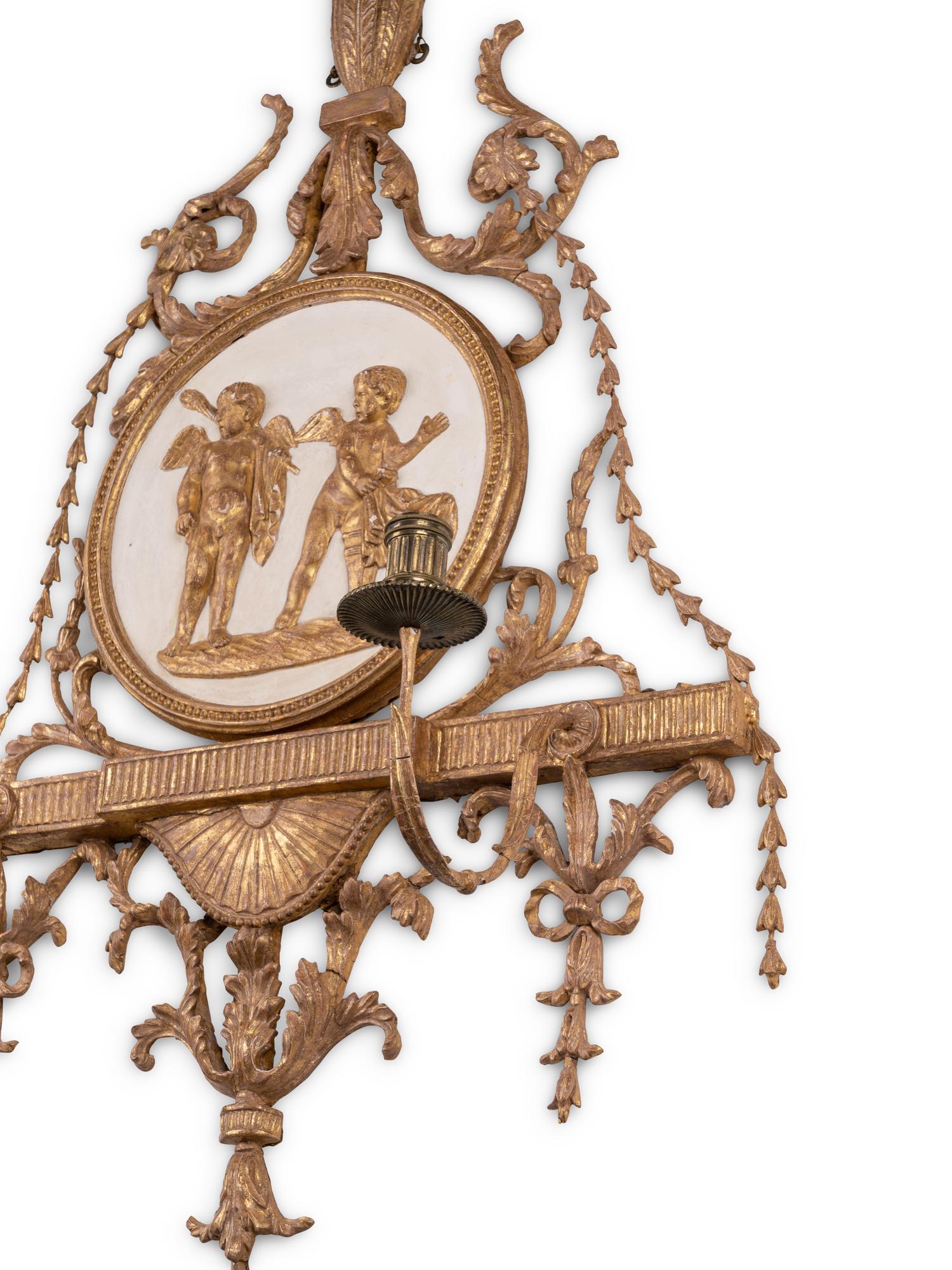 A George III Cream-Painted and Parcel-Gilt Two-Light Wall Appliqué
