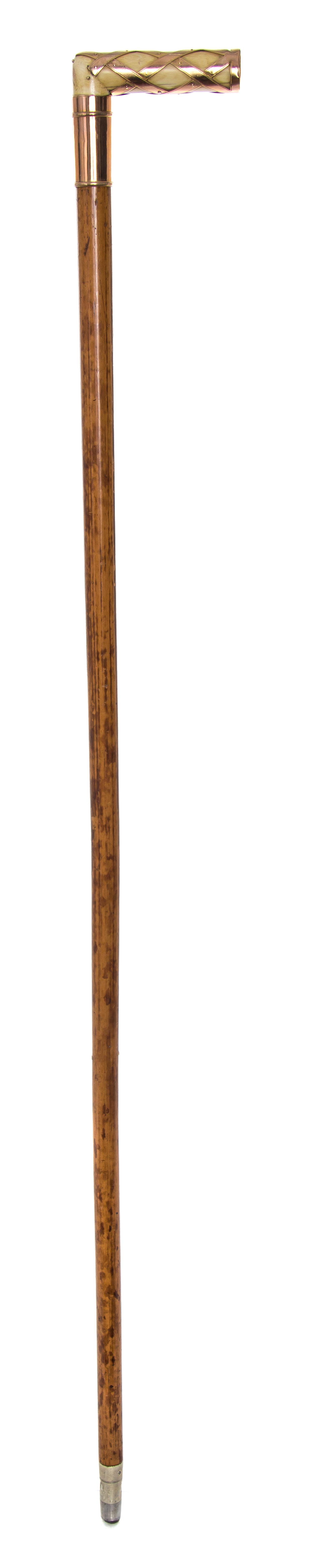 An American Ivory and 14 Karat Gold Handled Cane, Length of handle 2 1/2 x length overall 35 inches.