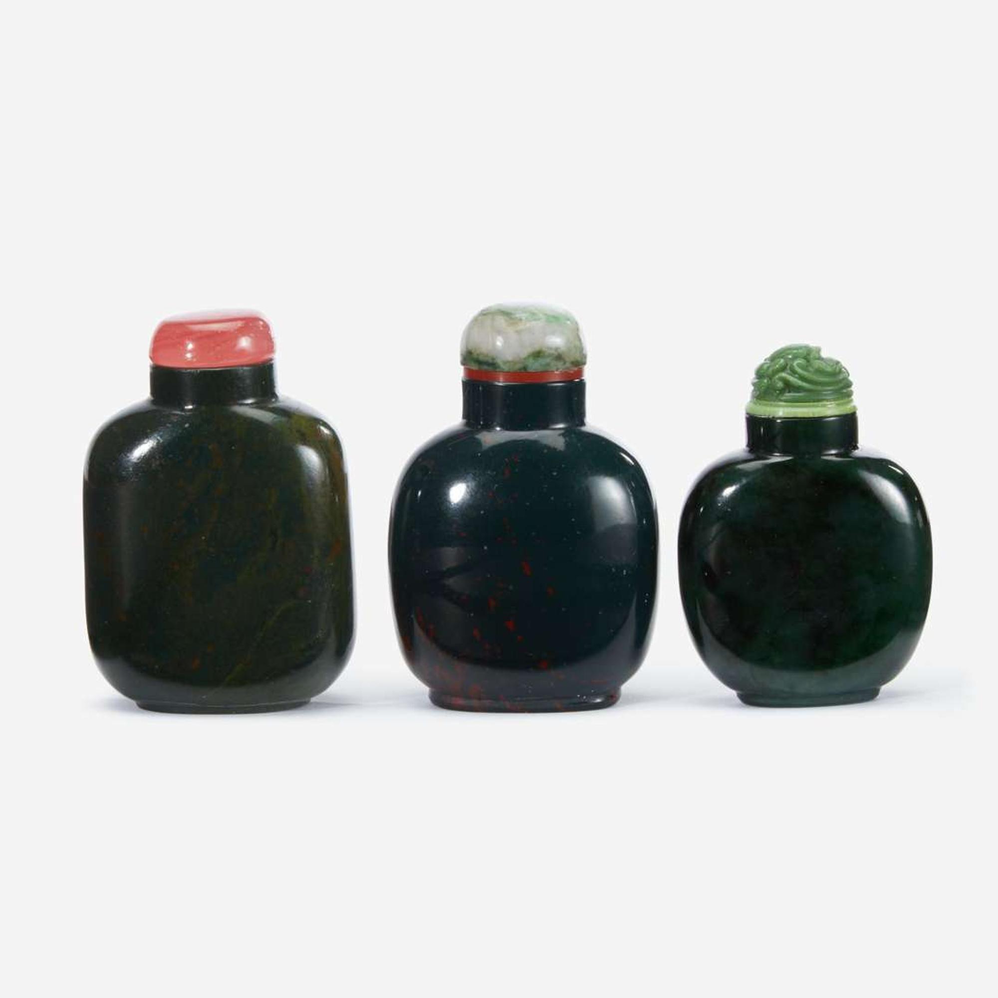 Three Chinese green hardstone snuff bottles